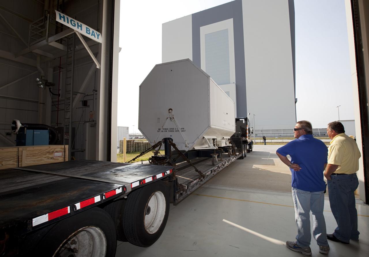 CAPE CANAVERAL, Fla. – In the Orbiter Processing Facility-3 engine shop at NASA's Kennedy Space Center in Florida, a transportation canister containing the last Pratt and Whitney Rocketdyne space shuttle main engine, or SSME, is secured on a flatbed truck and ready for departure to NASA's Stennis Space Center in Mississippi. The first two groups of engines were shipped from Kennedy to Stennis in November 2011 and January 2012 the remaining engines departed today. Altogether, 15 shuttle-era engines will be stored at Stennis for reuse on NASA’s Space Launch System heavy-lift rocket, under development. Photo credit: NASA/Dimitri Gerondidakis