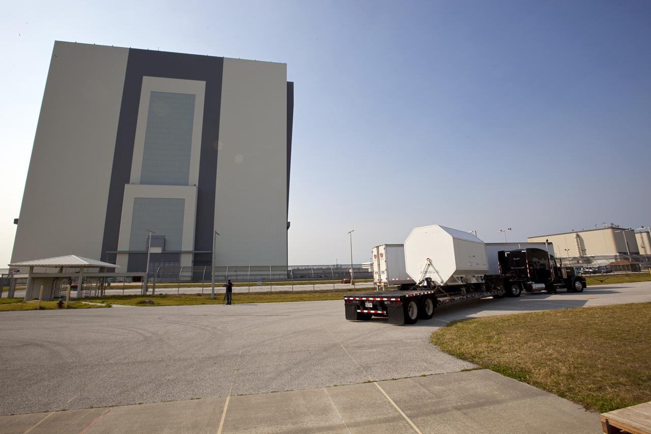 CAPE CANAVERAL, Fla. – A flatbed truck departs from the Orbiter Processing Facility-3 engine shop at NASA's Kennedy Space Center in Florida transporting the last Pratt and Whitney Rocketdyne space shuttle main engine, or SSME, to NASA's Stennis Space Center in Mississippi. The first two groups of engines were shipped from Kennedy to Stennis in November 2011 and January 2012 the remaining engines departed today. Altogether, 15 shuttle-era engines will be stored at Stennis for reuse on NASA’s Space Launch System heavy-lift rocket, under development. Photo credit: NASA/Dimitri Gerondidakis