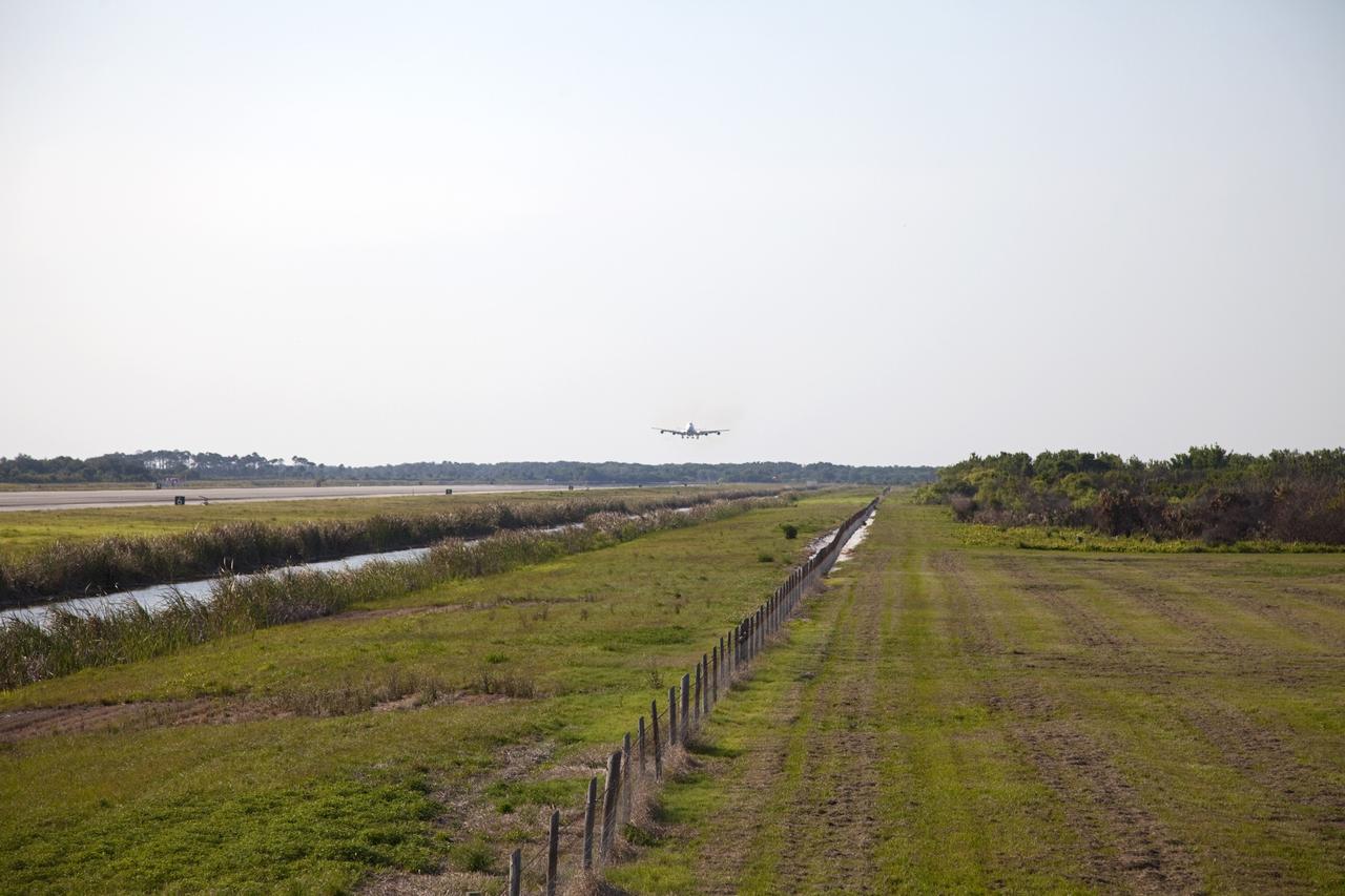 CAPE CANAVERAL, Fla. – The Shuttle Carrier Aircraft approaches the Shuttle Landing Facility at NASA’s Kennedy Space Center in Florida.    The aircraft, known as an SCA, arrived at 5:35 p.m. EDT to prepare for shuttle Discovery’s ferry flight to the Washington Dulles International Airport in Sterling, Va., on April 17. This SCA, designated NASA 905, is a modified Boeing 747 jet airliner, originally manufactured for commercial use. One of two SCAs employed over the course of the Space Shuttle Program, NASA 905 is assigned to the remaining ferry missions, delivering the shuttles to their permanent public display sites.  NASA 911 was decommissioned at the NASA Dryden Flight Research Center in California in February. Discovery will be placed on permanent public display in the Smithsonian's National Air and Space Museum Steven F. Udvar-Hazy Center in Chantilly, Va.  For more information on the SCA, visit http://www.nasa.gov/centers/dryden/news/FactSheets/FS-013-DFRC.html. For more information on shuttle transition and retirement activities, visit http://www.nasa.gov/shuttle. Photo credit: NASA/Frankie Martin