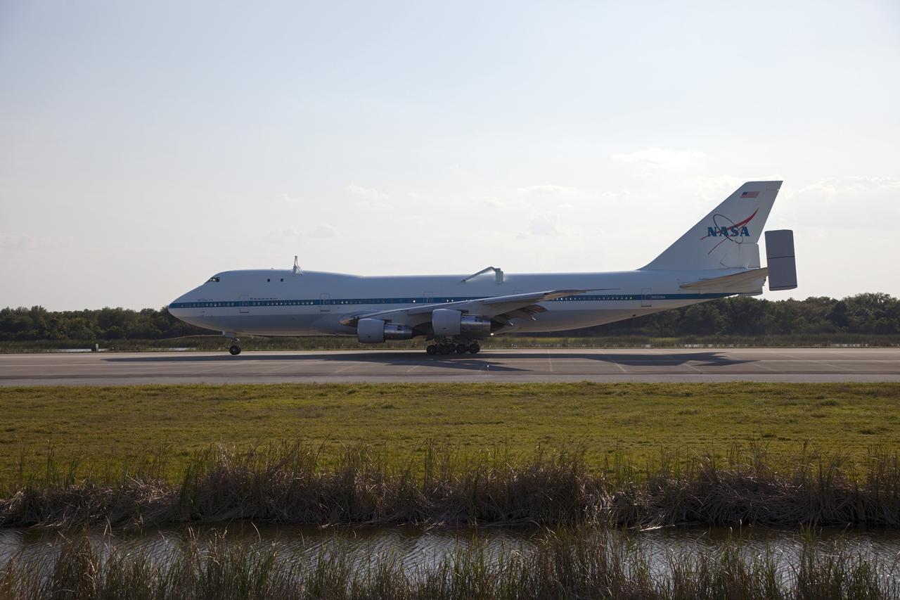 CAPE CANAVERAL, Fla. – NASA pilot Jeff Moultrie guides the Shuttle Carrier Aircraft to a picture-perfect touchdown at the Shuttle Landing Facility at NASA’s Kennedy Space Center in Florida with NASA co-pilot Bill Rieke at his side.    The aircraft, known as an SCA, arrived at 5:35 p.m. EDT to prepare for shuttle Discovery’s ferry flight to the Washington Dulles International Airport in Sterling, Va., on April 17. This SCA, designated NASA 905, is a modified Boeing 747 jet airliner, originally manufactured for commercial use. One of two SCAs employed over the course of the Space Shuttle Program, NASA 905 is assigned to the remaining ferry missions, delivering the shuttles to their permanent public display sites.  NASA 911 was decommissioned at the NASA Dryden Flight Research Center in California in February. Discovery will be placed on permanent public display in the Smithsonian's National Air and Space Museum Steven F. Udvar-Hazy Center in Chantilly, Va.  For more information on the SCA, visit http://www.nasa.gov/centers/dryden/news/FactSheets/FS-013-DFRC.html. For more information on shuttle transition and retirement activities, visit http://www.nasa.gov/shuttle. Photo credit: NASA/Frankie Martin