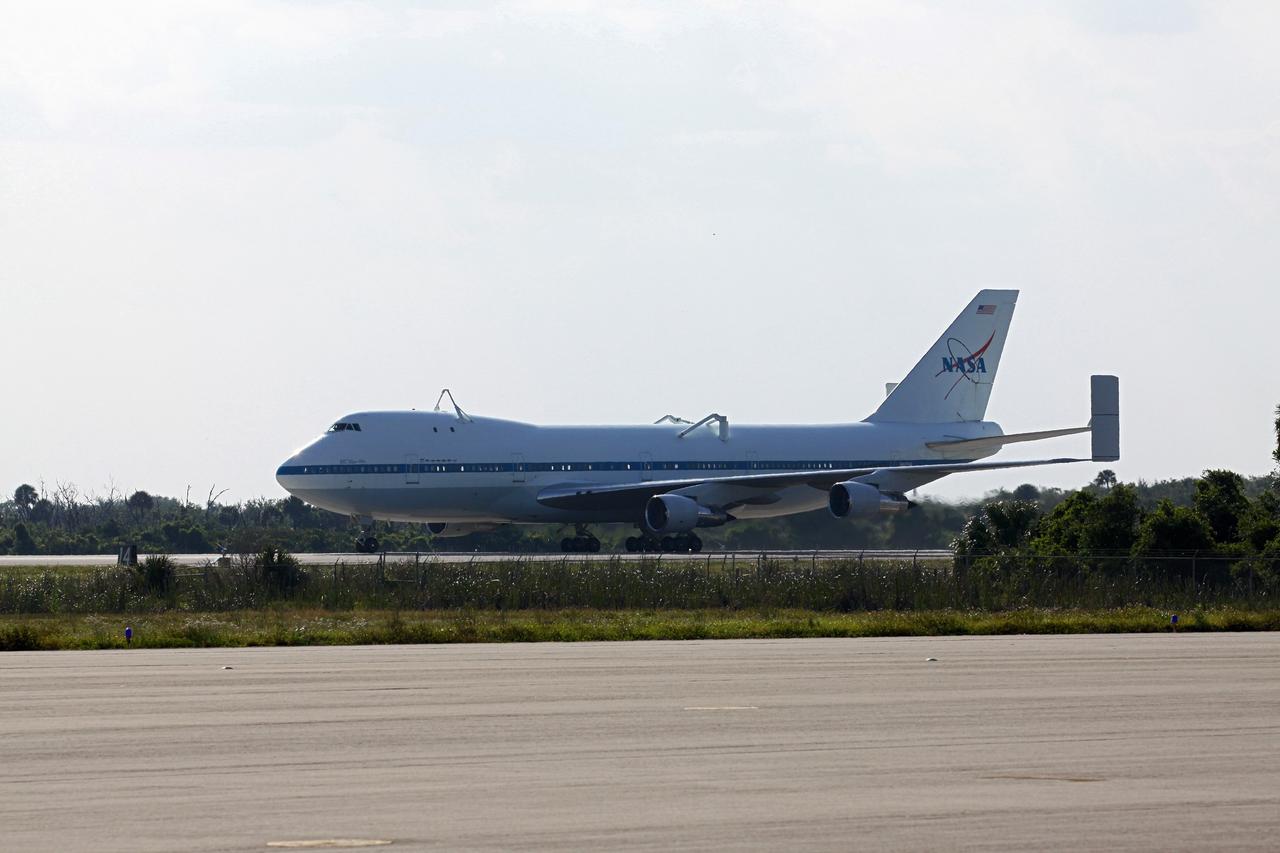 CAPE CANAVERAL, Fla. – The Shuttle Carrier Aircraft glides down the runway of the Shuttle Landing Facility at NASA’s Kennedy Space Center in Florida.    The aircraft, known as an SCA, arrived at 5:35 p.m. EDT to prepare for shuttle Discovery’s ferry flight to the Washington Dulles International Airport in Sterling, Va., on April 17. This SCA, designated NASA 905, is a modified Boeing 747 jet airliner, originally manufactured for commercial use. One of two SCAs employed over the course of the Space Shuttle Program, NASA 905 is assigned to the remaining ferry missions, delivering the shuttles to their permanent public display sites.  NASA 911 was decommissioned at the NASA Dryden Flight Research Center in California in February. Discovery will be placed on permanent public display in the Smithsonian's National Air and Space Museum Steven F. Udvar-Hazy Center in Chantilly, Va.  For more information on the SCA, visit http://www.nasa.gov/centers/dryden/news/FactSheets/FS-013-DFRC.html. For more information on shuttle transition and retirement activities, visit http://www.nasa.gov/shuttle. Photo credit: NASA/Kim Shiflett