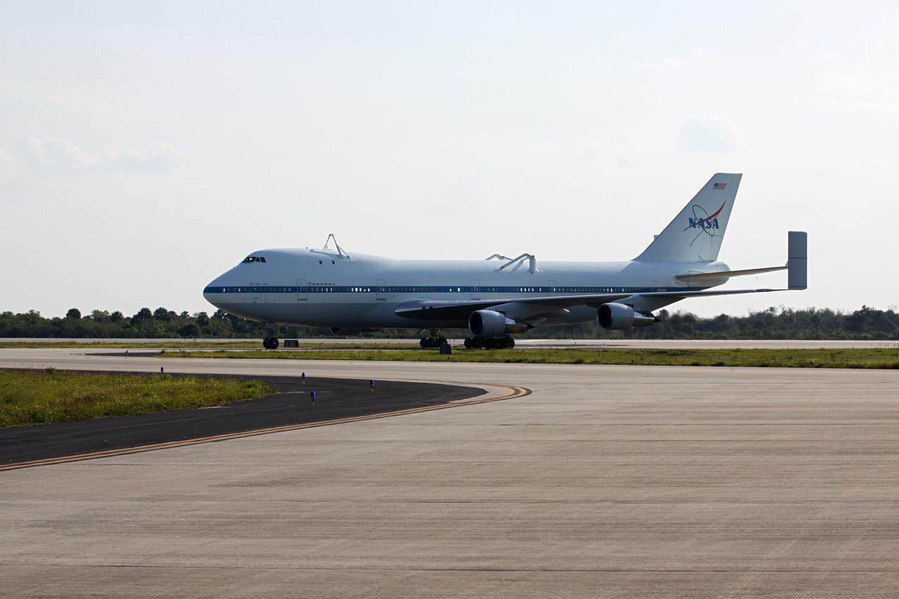 CAPE CANAVERAL, Fla. – The Shuttle Carrier Aircraft approaches the apron of the runway at the Shuttle Landing Facility at NASA’s Kennedy Space Center in Florida.    The aircraft, known as an SCA, arrived at 5:35 p.m. EDT to prepare for shuttle Discovery’s ferry flight to the Washington Dulles International Airport in Sterling, Va., on April 17. This SCA, designated NASA 905, is a modified Boeing 747 jet airliner, originally manufactured for commercial use. One of two SCAs employed over the course of the Space Shuttle Program, NASA 905 is assigned to the remaining ferry missions, delivering the shuttles to their permanent public display sites.  NASA 911 was decommissioned at the NASA Dryden Flight Research Center in California in February. Discovery will be placed on permanent public display in the Smithsonian's National Air and Space Museum Steven F. Udvar-Hazy Center in Chantilly, Va.  For more information on the SCA, visit http://www.nasa.gov/centers/dryden/news/FactSheets/FS-013-DFRC.html. For more information on shuttle transition and retirement activities, visit http://www.nasa.gov/shuttle. Photo credit: NASA/Kim Shiflett