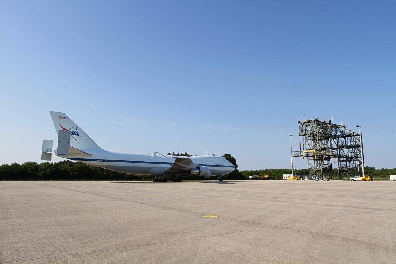 CAPE CANAVERAL, Fla. – The Shuttle Carrier Aircraft approaches the mate/demate device at the Shuttle Landing Facility at NASA’s Kennedy Space Center in Florida.    The aircraft, known as an SCA, arrived at 5:35 p.m. EDT to prepare for shuttle Discovery’s ferry flight to the Washington Dulles International Airport in Sterling, Va., on April 17. This SCA, designated NASA 905, is a modified Boeing 747 jet airliner, originally manufactured for commercial use. One of two SCAs employed over the course of the Space Shuttle Program, NASA 905 is assigned to the remaining ferry missions, delivering the shuttles to their permanent public display sites.  NASA 911 was decommissioned at the NASA Dryden Flight Research Center in California in February. Discovery will be placed on permanent public display in the Smithsonian's National Air and Space Museum Steven F. Udvar-Hazy Center in Chantilly, Va.  For more information on the SCA, visit http://www.nasa.gov/centers/dryden/news/FactSheets/FS-013-DFRC.html. For more information on shuttle transition and retirement activities, visit http://www.nasa.gov/shuttle. Photo credit: NASA/Kim Shiflett