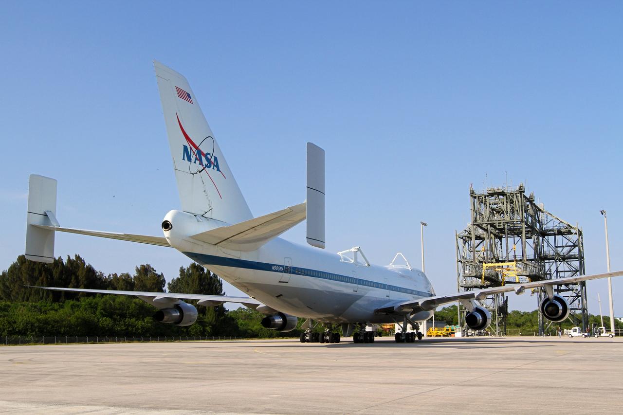 CAPE CANAVERAL, Fla. – The Shuttle Carrier Aircraft parks near the mate/demate device at the Shuttle Landing Facility at NASA’s Kennedy Space Center in Florida.    The aircraft, known as an SCA, arrived at 5:35 p.m. EDT to prepare for shuttle Discovery’s ferry flight to the Washington Dulles International Airport in Sterling, Va., on April 17. This SCA, designated NASA 905, is a modified Boeing 747 jet airliner, originally manufactured for commercial use. One of two SCAs employed over the course of the Space Shuttle Program, NASA 905 is assigned to the remaining ferry missions, delivering the shuttles to their permanent public display sites.  NASA 911 was decommissioned at the NASA Dryden Flight Research Center in California in February. Discovery will be placed on permanent public display in the Smithsonian's National Air and Space Museum Steven F. Udvar-Hazy Center in Chantilly, Va.  For more information on the SCA, visit http://www.nasa.gov/centers/dryden/news/FactSheets/FS-013-DFRC.html. For more information on shuttle transition and retirement activities, visit http://www.nasa.gov/shuttle. Photo credit: NASA/Kim Shiflett