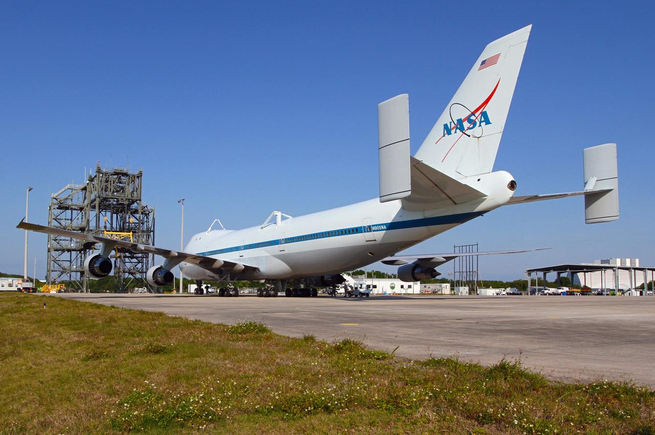 CAPE CANAVERAL, Fla. – The Shuttle Carrier Aircraft parks near the mate/demate device at the Shuttle Landing Facility at NASA’s Kennedy Space Center in Florida.    The aircraft, known as an SCA, arrived at 5:35 p.m. EDT to prepare for shuttle Discovery’s ferry flight to the Washington Dulles International Airport in Sterling, Va., on April 17. This SCA, designated NASA 905, is a modified Boeing 747 jet airliner, originally manufactured for commercial use. One of two SCAs employed over the course of the Space Shuttle Program, NASA 905 is assigned to the remaining ferry missions, delivering the shuttles to their permanent public display sites.  NASA 911 was decommissioned at the NASA Dryden Flight Research Center in California in February. Discovery will be placed on permanent public display in the Smithsonian's National Air and Space Museum Steven F. Udvar-Hazy Center in Chantilly, Va.  For more information on the SCA, visit http://www.nasa.gov/centers/dryden/news/FactSheets/FS-013-DFRC.html. For more information on shuttle transition and retirement activities, visit http://www.nasa.gov/shuttle. Photo credit: NASA/Kim Shiflett