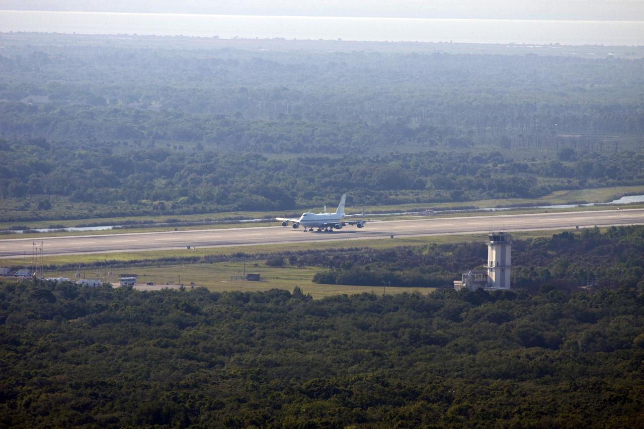 CAPE CANAVERAL, Fla. – The Shuttle Carrier Aircraft glides down the runway at the Shuttle Landing Facility at NASA’s Kennedy Space Center in Florida.    The aircraft, known as an SCA, arrived at 5:35 p.m. EDT to prepare for shuttle Discovery’s ferry flight to the Washington Dulles International Airport in Sterling, Va., on April 17. This SCA, designated NASA 905, is a modified Boeing 747 jet airliner, originally manufactured for commercial use. One of two SCAs employed over the course of the Space Shuttle Program, NASA 905 is assigned to the remaining ferry missions, delivering the shuttles to their permanent public display sites.  NASA 911 was decommissioned at the NASA Dryden Flight Research Center in California in February. Discovery will be placed on permanent public display in the Smithsonian's National Air and Space Museum Steven F. Udvar-Hazy Center in Chantilly, Va.  For more information on the SCA, visit http://www.nasa.gov/centers/dryden/news/FactSheets/FS-013-DFRC.html. For more information on shuttle transition and retirement activities, visit http://www.nasa.gov/shuttle. Photo credit: NASA/Jim Grossmann