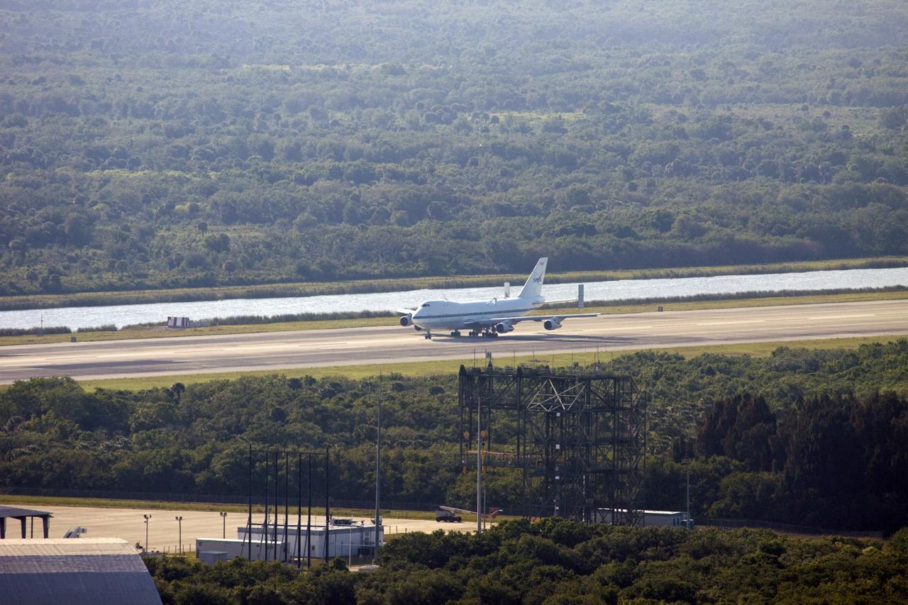 CAPE CANAVERAL, Fla. – The Shuttle Carrier Aircraft coasts down the runway at the Shuttle Landing Facility at NASA’s Kennedy Space Center in Florida.    The aircraft, known as an SCA, arrived at 5:35 p.m. EDT to prepare for shuttle Discovery’s ferry flight to the Washington Dulles International Airport in Sterling, Va., on April 17. This SCA, designated NASA 905, is a modified Boeing 747 jet airliner, originally manufactured for commercial use. One of two SCAs employed over the course of the Space Shuttle Program, NASA 905 is assigned to the remaining ferry missions, delivering the shuttles to their permanent public display sites.  NASA 911 was decommissioned at the NASA Dryden Flight Research Center in California in February. Discovery will be placed on permanent public display in the Smithsonian's National Air and Space Museum Steven F. Udvar-Hazy Center in Chantilly, Va.  For more information on the SCA, visit http://www.nasa.gov/centers/dryden/news/FactSheets/FS-013-DFRC.html. For more information on shuttle transition and retirement activities, visit http://www.nasa.gov/shuttle. Photo credit: NASA/Jim Grossmann