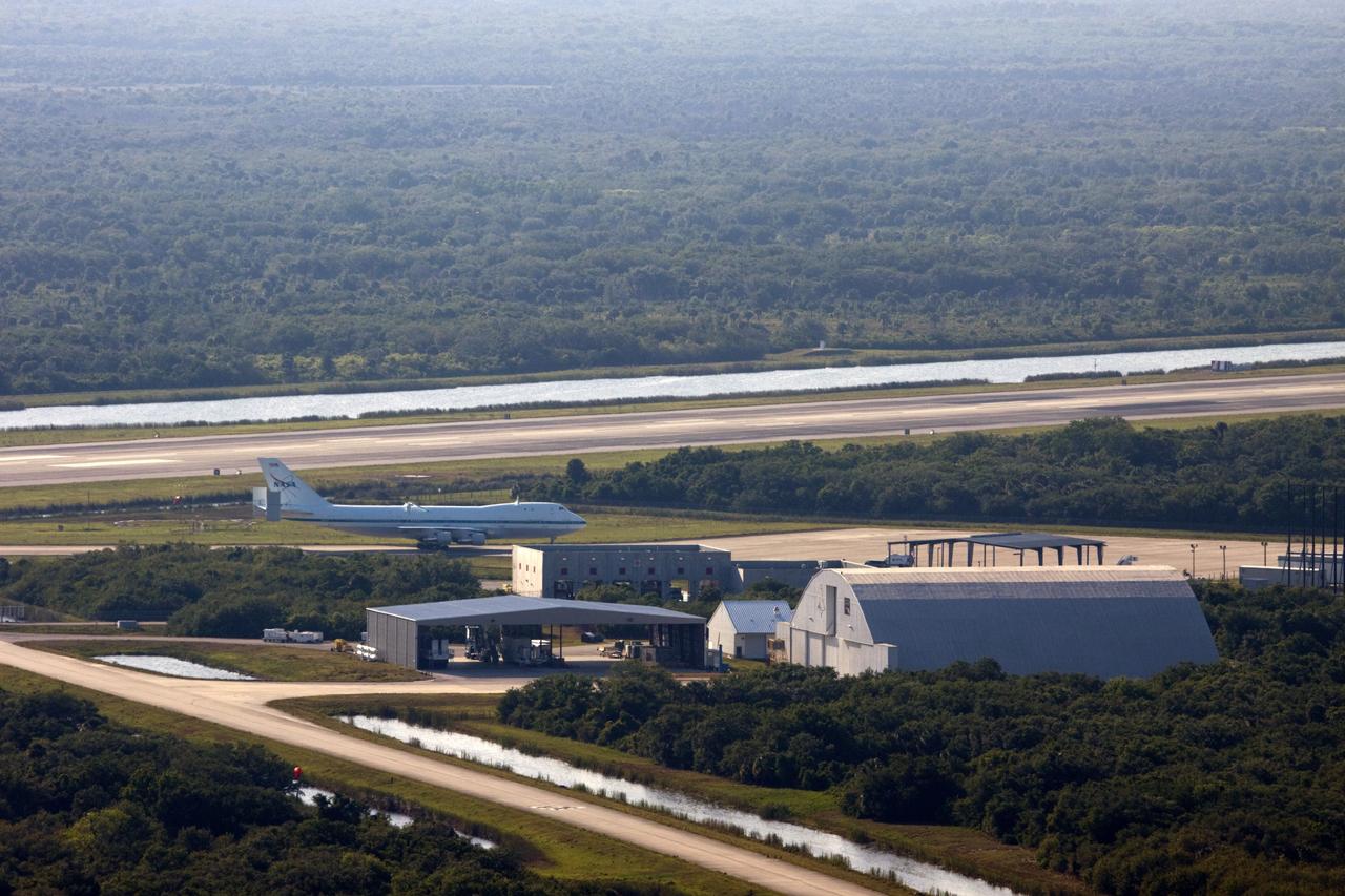 CAPE CANAVERAL, Fla. – The Shuttle Carrier Aircraft glides onto the apron of the runway at the Shuttle Landing Facility at NASA’s Kennedy Space Center in Florida.    The aircraft, known as an SCA, arrived at 5:35 p.m. EDT to prepare for shuttle Discovery’s ferry flight to the Washington Dulles International Airport in Sterling, Va., on April 17. This SCA, designated NASA 905, is a modified Boeing 747 jet airliner, originally manufactured for commercial use. One of two SCAs employed over the course of the Space Shuttle Program, NASA 905 is assigned to the remaining ferry missions, delivering the shuttles to their permanent public display sites.  NASA 911 was decommissioned at the NASA Dryden Flight Research Center in California in February. Discovery will be placed on permanent public display in the Smithsonian's National Air and Space Museum Steven F. Udvar-Hazy Center in Chantilly, Va.  For more information on the SCA, visit http://www.nasa.gov/centers/dryden/news/FactSheets/FS-013-DFRC.html. For more information on shuttle transition and retirement activities, visit http://www.nasa.gov/shuttle. Photo credit: NASA/Jim Grossmann