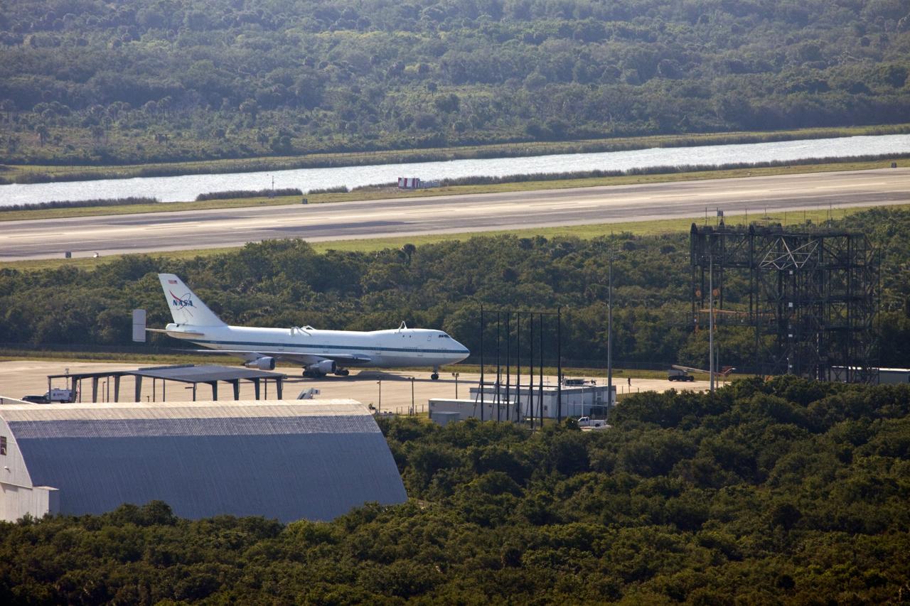 CAPE CANAVERAL, Fla. – The Shuttle Carrier Aircraft approaches the mate/demate device at the Shuttle Landing Facility at NASA’s Kennedy Space Center in Florida.    The aircraft, known as an SCA, arrived at 5:35 p.m. EDT to prepare for shuttle Discovery’s ferry flight to the Washington Dulles International Airport in Sterling, Va., on April 17. This SCA, designated NASA 905, is a modified Boeing 747 jet airliner, originally manufactured for commercial use. One of two SCAs employed over the course of the Space Shuttle Program, NASA 905 is assigned to the remaining ferry missions, delivering the shuttles to their permanent public display sites.  NASA 911 was decommissioned at the NASA Dryden Flight Research Center in California in February. Discovery will be placed on permanent public display in the Smithsonian's National Air and Space Museum Steven F. Udvar-Hazy Center in Chantilly, Va.  For more information on the SCA, visit http://www.nasa.gov/centers/dryden/news/FactSheets/FS-013-DFRC.html. For more information on shuttle transition and retirement activities, visit http://www.nasa.gov/shuttle. Photo credit: NASA/Jim Grossmann