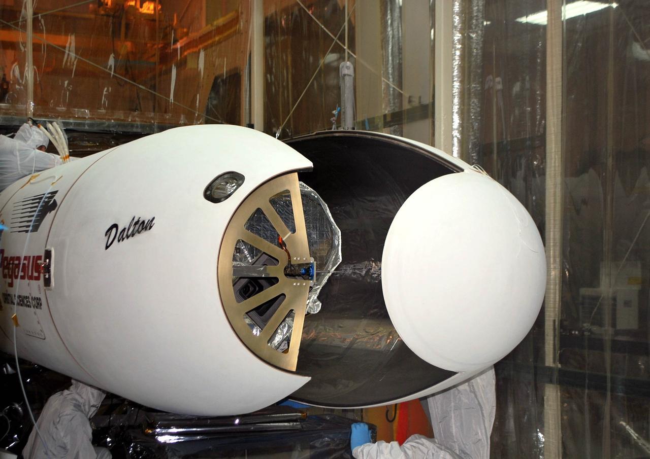 VANDENBERG AIR FORCE BASE, Calif. – The Pegasus payload fairing has been opened to reveal NASA’s Nuclear Spectroscopic Telescope Array, or NuSTAR, in Orbital Sciences’ hangar on Vandenberg Air Force Base in California.    Access to the spacecraft is needed for compatibility testing to verify communication with a tracking station in Hawaii. With the change in the launch timeframe to June, this station will be needed to support launch. After processing of Orbital’s Pegasus XL rocket and the spacecraft are complete, they will be flown on Orbital's L-1011 carrier aircraft from Vandenberg to the Ronald Reagan Ballistic Missile Defense Test Site on the Pacific Ocean’s Kwajalein Atoll for launch.  The high-energy X-ray telescope will conduct a census of black holes, map radioactive material in young supernovae remnants, and study the origins of cosmic rays and the extreme physics around collapsed stars. For more information, visit http://www.nasa.gov/nustar.  Photo credit: NASA/Randy Beaudoin, VAFB