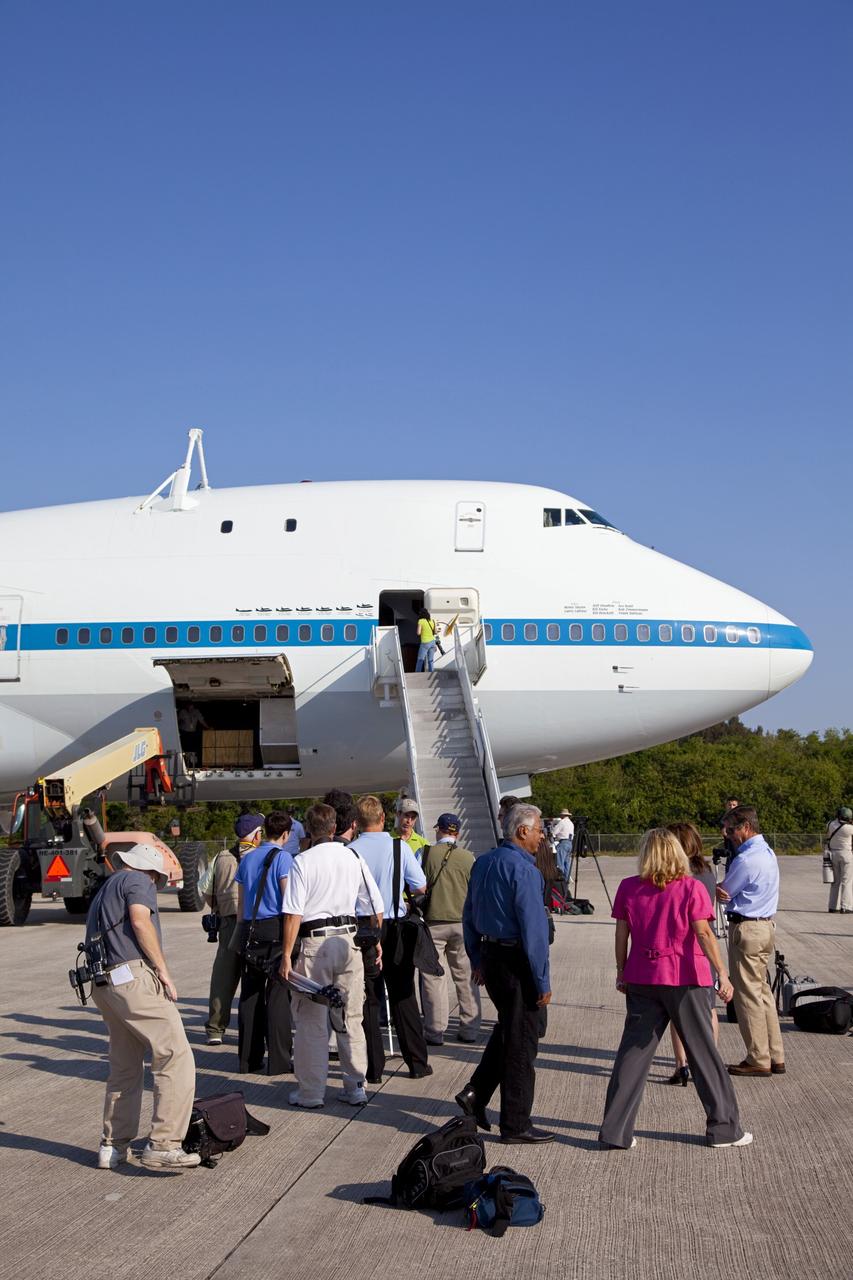 CAPE CANAVERAL, Fla. – At NASA’s Kennedy Space Center in Florida, NASA’s Shuttle Carrier Aircraft modified 747 jet, or SCA, has arrived at the Shuttle Landing Facility, or SLF, after a 5-hour flight from Edwards Air Force Base in California. On the SLF tarmac, members of the media talk to the SCA pilots.    During the Space Shuttle Program’s transition and retirement processing, Discovery was prepared for display at Smithsonian’s National Air and Space Museum, Steven F. Udvar-Hazy Center in Chantilly, Va. Discovery is scheduled to be transported atop the SCA, designated NASA 905, to Dulles International Airport in Virginia on April 17 and then moved to the Smithsonian for permanent public display on April 19. The SCA is assigned to the remaining ferry missions, delivering the shuttles to their permanent public display sites. For more information, visit http://www.nasa.gov/shuttle.  Photo credit: NASA/Frankie Martin