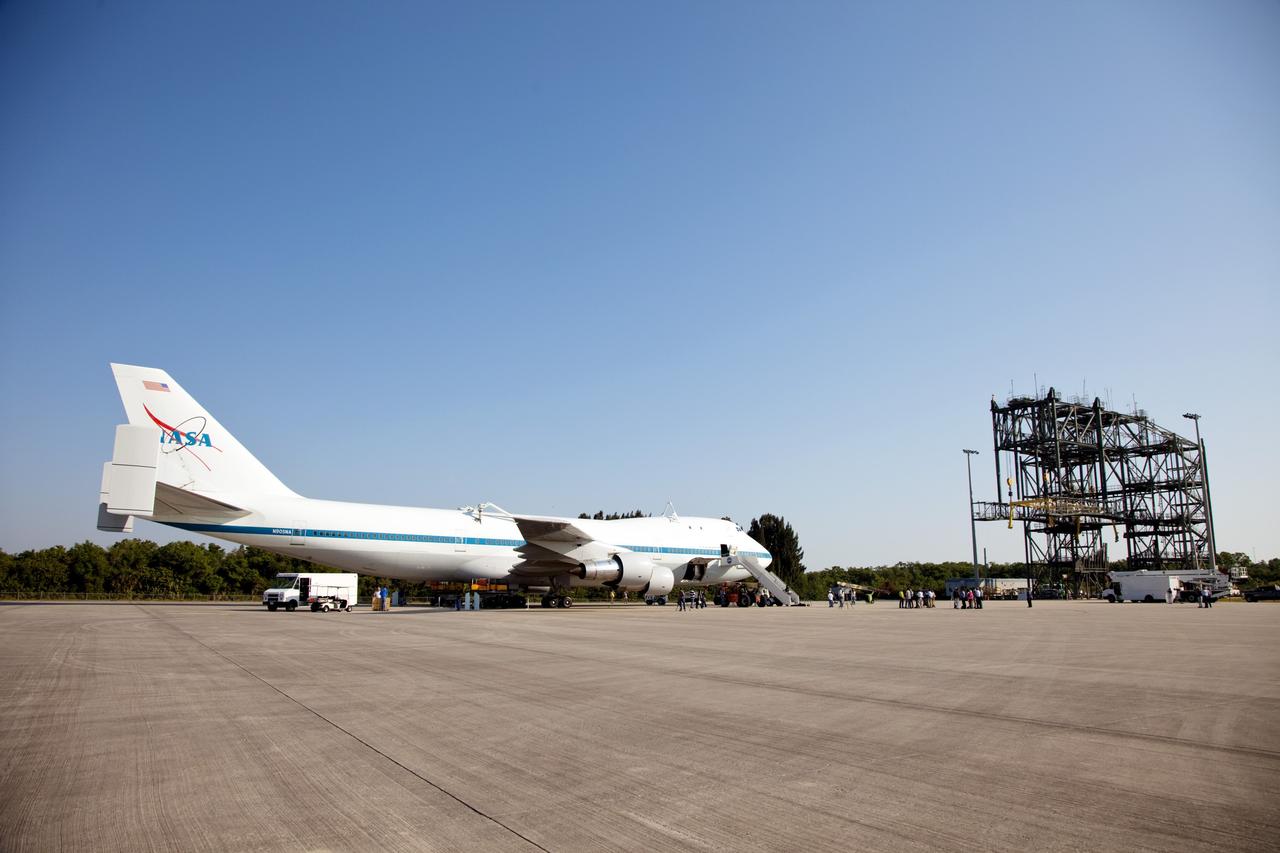 CAPE CANAVERAL, Fla. – At NASA’s Kennedy Space Center in Florida, NASA’s Shuttle Carrier Aircraft modified 747 jet, or SCA, has arrived at the Shuttle Landing Facility, or SLF, after a 5-hour flight from Edwards Air Force Base in California. To the right is the Mate/Demate device that will be used to lift and attach Discovery atop the SCA. During the Space Shuttle Program’s transition and retirement processing, Discovery was prepared for display at Smithsonian’s National Air and Space Museum, Steven F. Udvar-Hazy Center in Chantilly, Va. Discovery is scheduled to be transported atop the SCA, designated NASA 905, to Dulles International Airport in Virginia on April 17 and then moved to the Smithsonian for permanent public display on April 19. The SCA is assigned to the remaining ferry missions, delivering the shuttles to their permanent public display sites. For more information, visit http://www.nasa.gov/shuttle. Photo credit: NASA/Frankie Martin