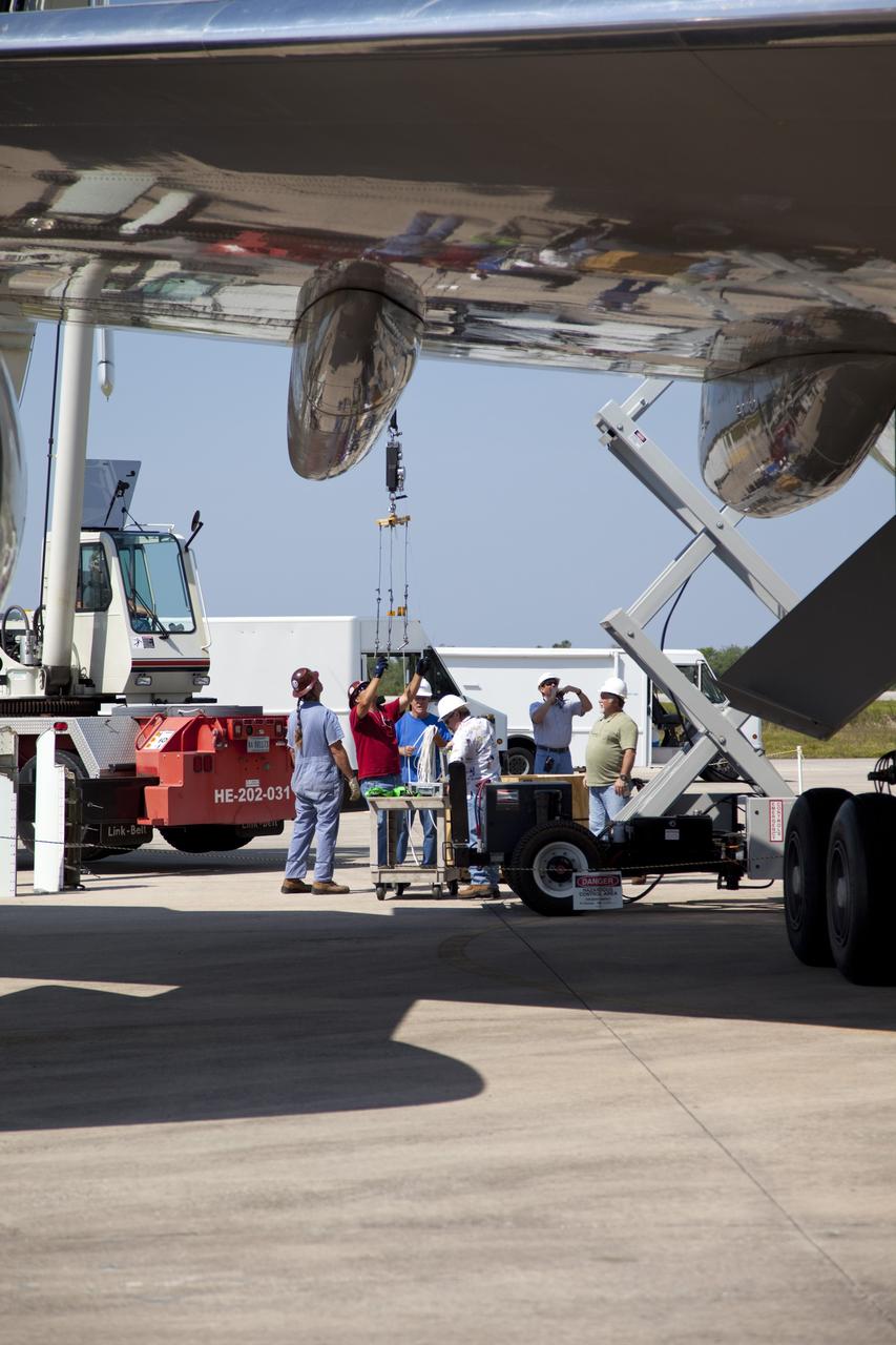 CAPE CANAVERAL, Fla. – At the Shuttle Landing Facility at NASA’s Kennedy Space Center in Florida, maintenance technicians from NASA’s Dryden Flight Research Center in California and Kennedy check NASA’s Shuttle Carrier Aircraft modified 747 jet, or SCA, after arriving from Edwards Air Force Base in California.      During the Space Shuttle Program’s transition and retirement processing, Discovery was prepared for display at Smithsonian’s National Air and Space Museum, Steven F. Udvar-Hazy Center in Chantilly, Va. Discovery is scheduled to be transported atop the SCA, designated NASA 905, to Dulles International Airport in Virginia on April 17 and then moved to the Smithsonian for permanent public display on April 19. The SCA is assigned to the remaining ferry missions, delivering the shuttles to their permanent public display sites. For more information, visit http://www.nasa.gov/shuttle.  Photo credit: NASA/Frankie Martin