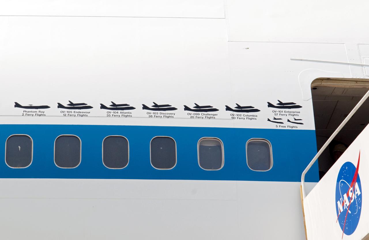 CAPE CANAVERAL, Fla. – Painted graphics line the side of NASA 905 depicting the various ferry flights the Shuttle Carrier Aircraft has supported during the Space Shuttle Program, including the tests using the space shuttle prototype Enterprise.    The aircraft, known as an SCA, is at Kennedy to prepare for shuttle Discovery’s ferry flight to the Washington Dulles International Airport in Sterling, Va., on April 17. The SCA is a modified Boeing 747 jet airliner, originally manufactured for commercial use. One of two SCAs employed over the course of the Space Shuttle Program, NASA 905 is assigned to the remaining ferry missions, delivering the shuttles to their permanent public display sites.  NASA 911 was decommissioned at the NASA Dryden Flight Research Center in California in February. Discovery will be placed on permanent public display in the Smithsonian's National Air and Space Museum Steven F. Udvar-Hazy Center in Chantilly, Va.  For more information on the SCA, visit http://www.nasa.gov/centers/dryden/news/FactSheets/FS-013-DFRC.html. For more information on shuttle transition and retirement activities, visit http://www.nasa.gov/shuttle. Photo credit: NASA/Ben Smegelsky