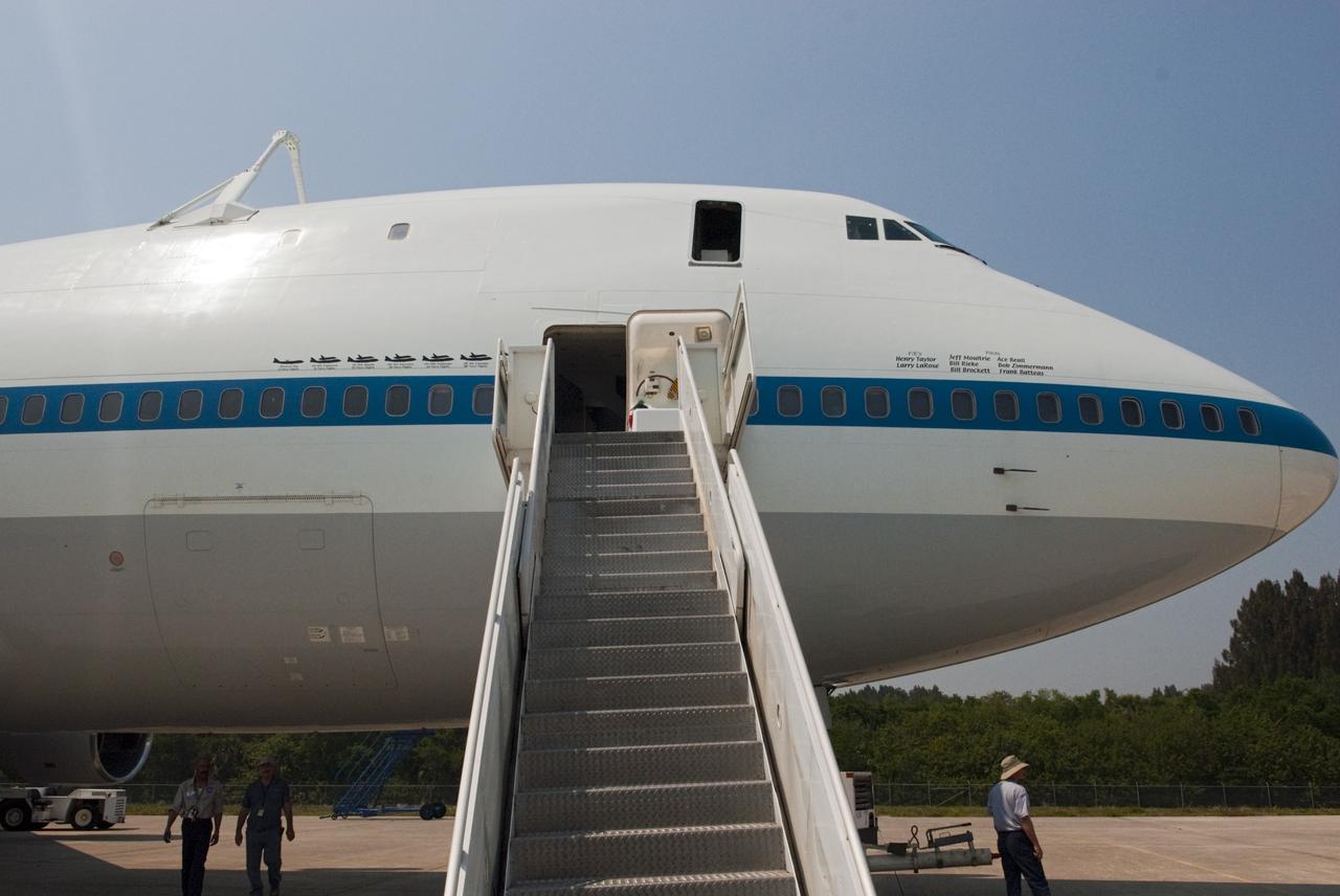 CAPE CANAVERAL, Fla. – Painted graphics line the side of NASA 905 depicting the various ferry flights the Shuttle Carrier Aircraft has supported during the Space Shuttle Program. The names of the pilots and flight engineers who have flown the aircraft also are listed.    The aircraft, known as an SCA, is at Kennedy to prepare for shuttle Discovery’s ferry flight to the Washington Dulles International Airport in Sterling, Va., on April 17. The SCA is a modified Boeing 747 jet airliner, originally manufactured for commercial use. One of two SCAs employed over the course of the Space Shuttle Program, NASA 905 is assigned to the remaining ferry missions, delivering the shuttles to their permanent public display sites.  NASA 911 was decommissioned at the NASA Dryden Flight Research Center in California in February. Discovery will be placed on permanent public display in the Smithsonian's National Air and Space Museum Steven F. Udvar-Hazy Center in Chantilly, Va.  For more information on the SCA, visit http://www.nasa.gov/centers/dryden/news/FactSheets/FS-013-DFRC.html. For more information on shuttle transition and retirement activities, visit http://www.nasa.gov/shuttle. Photo credit: NASA/Ben Smegelsky