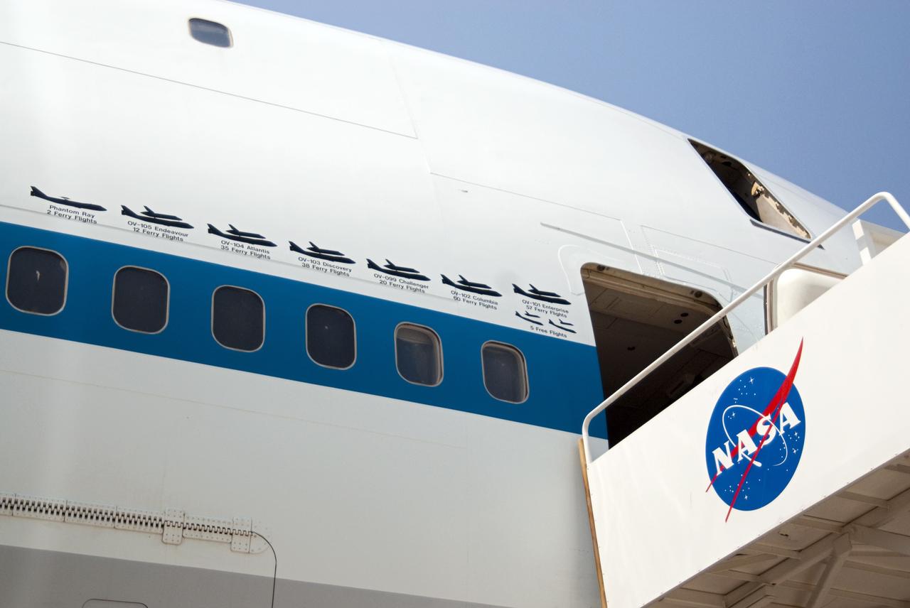 CAPE CANAVERAL, Fla. – Painted graphics line the side of NASA 905 depicting the various ferry flights the Shuttle Carrier Aircraft has supported during the Space Shuttle Program, including the tests using the space shuttle prototype Enterprise.    The aircraft, known as an SCA, is at Kennedy to prepare for shuttle Discovery’s ferry flight to the Washington Dulles International Airport in Sterling, Va., on April 17. The SCA is a modified Boeing 747 jet airliner, originally manufactured for commercial use. One of two SCAs employed over the course of the Space Shuttle Program, NASA 905 is assigned to the remaining ferry missions, delivering the shuttles to their permanent public display sites.  NASA 911 was decommissioned at the NASA Dryden Flight Research Center in California in February. Discovery will be placed on permanent public display in the Smithsonian's National Air and Space Museum Steven F. Udvar-Hazy Center in Chantilly, Va.  For more information on the SCA, visit http://www.nasa.gov/centers/dryden/news/FactSheets/FS-013-DFRC.html. For more information on shuttle transition and retirement activities, visit http://www.nasa.gov/shuttle. Photo credit: NASA/Ben Smegelsky