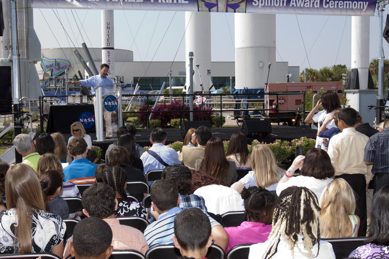 CAPE CANAVERAL, Fla. - Peter Cullen, the voice of OPTIMUS PRIME from the "Transformers" franchise, addresses students and teachers involved with the NASA OPTIMUS PRIME Spinoff Video Contest in the Rocket Garden of the Kennedy Space Center Visitor Complex. The contest challenged students in grades three through 12 to study NASA spinoff technologies and produce short, creative videos promoting their favorites. The NASA Goddard Space Flight Center's Innovative Partnerships Office in Greenbelt, Md., designed the contest to help students see the benefits of NASA technology here on Earth. NASA collaborated with Hasbro in using the OPTIMUS PRIME character. Photo credit: NASA/Jim Grossmann