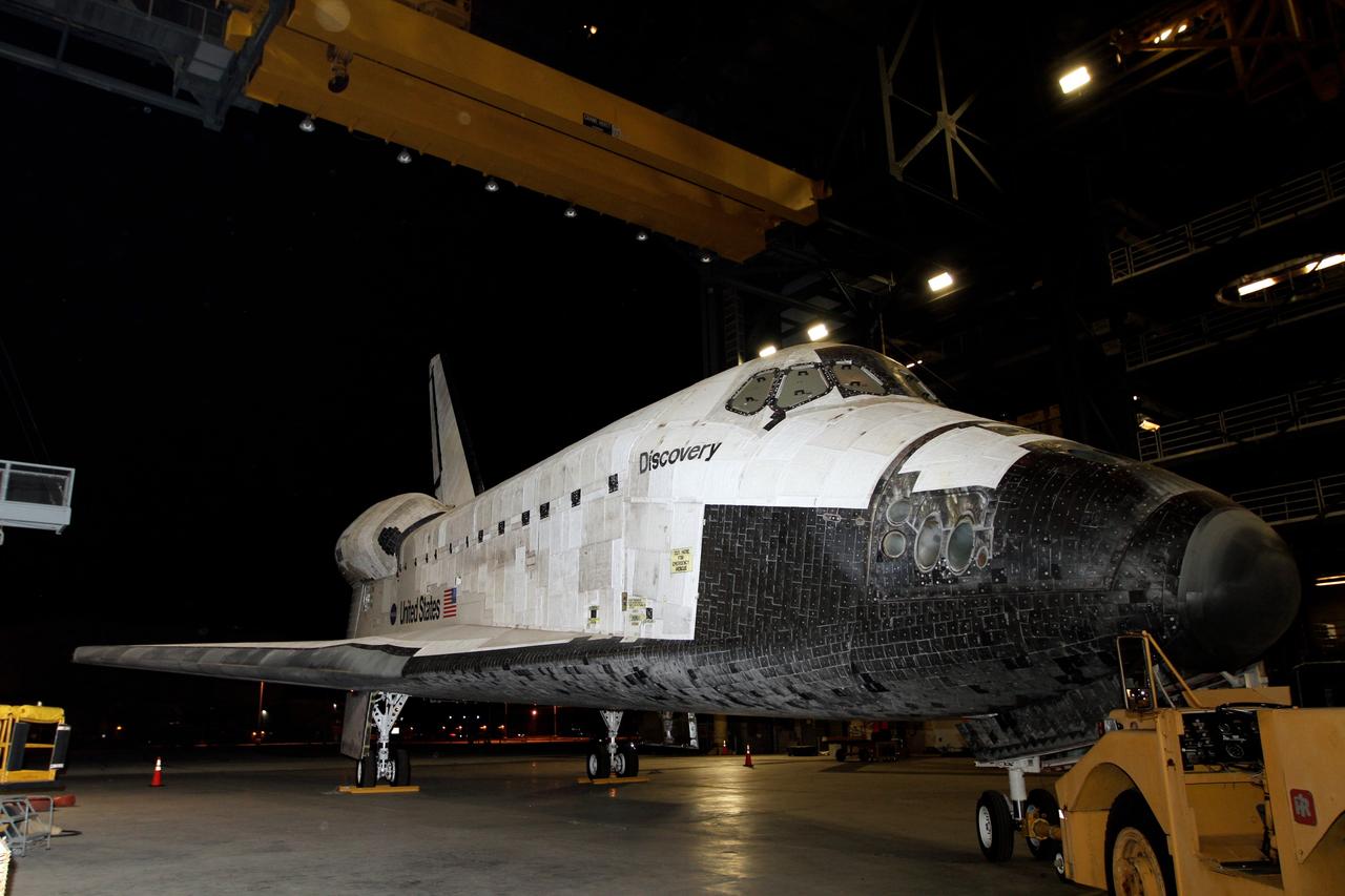 CAPE CANAVERAL, Fla. – Preparations to tow space shuttle Discovery from the Vehicle Assembly Building, or VAB, to the Shuttle Landing Facility, or SLF, are under way at NASA’s Kennedy Space Center in Florida.    Discovery was in storage in the VAB’s high bay 4 awaiting departure from Kennedy’s Launch Complex 39 area for the final time.  At the SLF, Discovery will be hoisted onto a Shuttle Carrier Aircraft, or SCA, with the aid of a mate-demate device.  The SCA, a modified Boeing 747 jet airliner, is scheduled to transport Discovery to the Washington Dulles International Airport in Virginia on April 17, after which the shuttle will be placed on permanent public display in the Smithsonian's National Air and Space Museum Steven F. Udvar-Hazy Center.  For more information on shuttle transition and retirement activities, visit http://www.nasa.gov/transition. Photo credit: NASA/Kim Shiflett