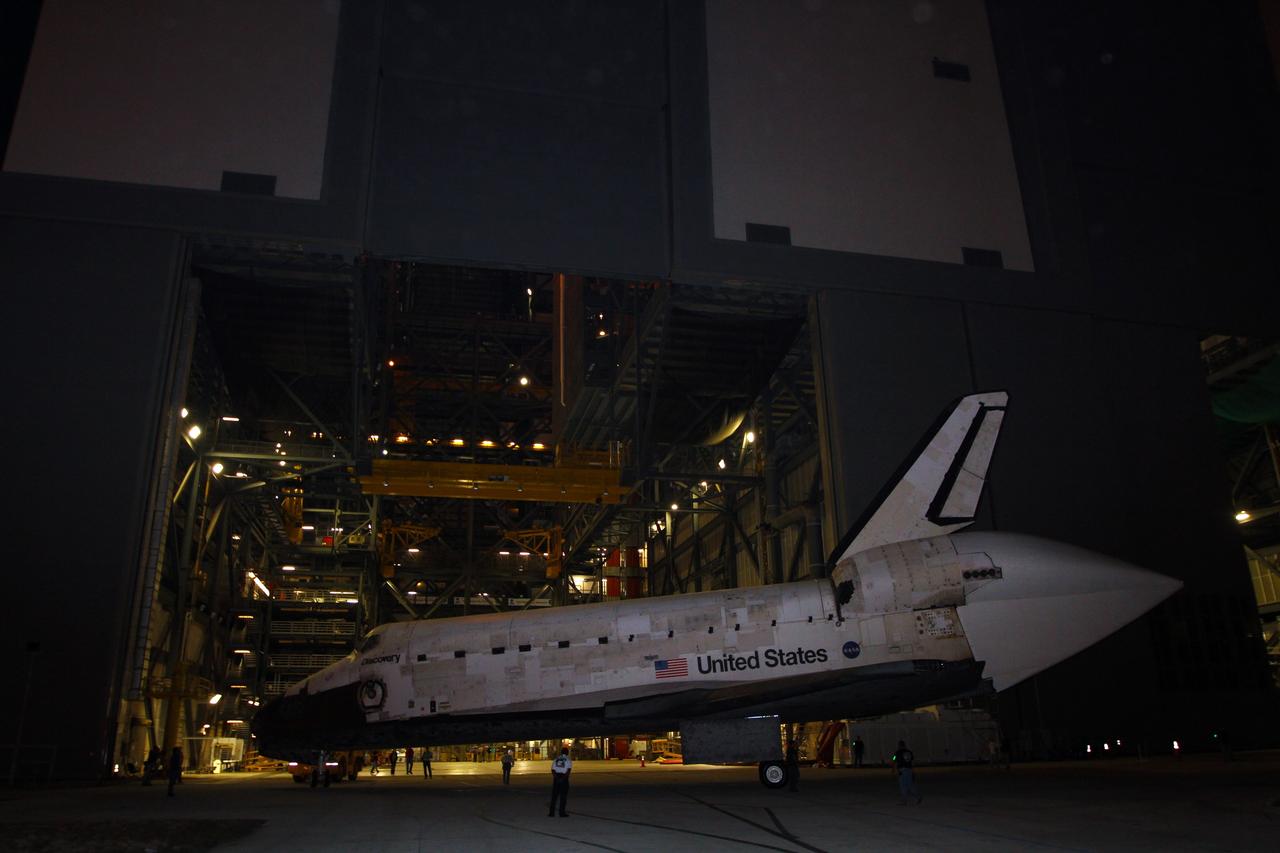 CAPE CANAVERAL, Fla. – Space shuttle Discovery executes a three-point turnaround outside the Vehicle Assembly Building, or VAB, at NASA’s Kennedy Space Center in Florida, for its trip to the Shuttle Landing Facility, or SLF. Its move got under way at 5 a.m. EDT. A tail cone has been installed over its three replica shuttle main engines to reduce aerodynamic drag and turbulence during its upcoming ferry flight. Discovery was in storage in the VAB’s high bay 4 awaiting departure from Kennedy’s Launch Complex 39 area for the final time. At the SLF, Discovery will be hoisted onto a Shuttle Carrier Aircraft, or SCA, with the aid of a mate-demate device. The SCA, a modified Boeing 747 jet airliner, is scheduled to transport Discovery to the Washington Dulles International Airport in Virginia on April 17, after which the shuttle will be placed on permanent public display in the Smithsonian's National Air and Space Museum Steven F. Udvar-Hazy Center. For more information on shuttle transition and retirement activities, visit http://www.nasa.gov/transition. Photo credit: NASA/Kim Shiflett