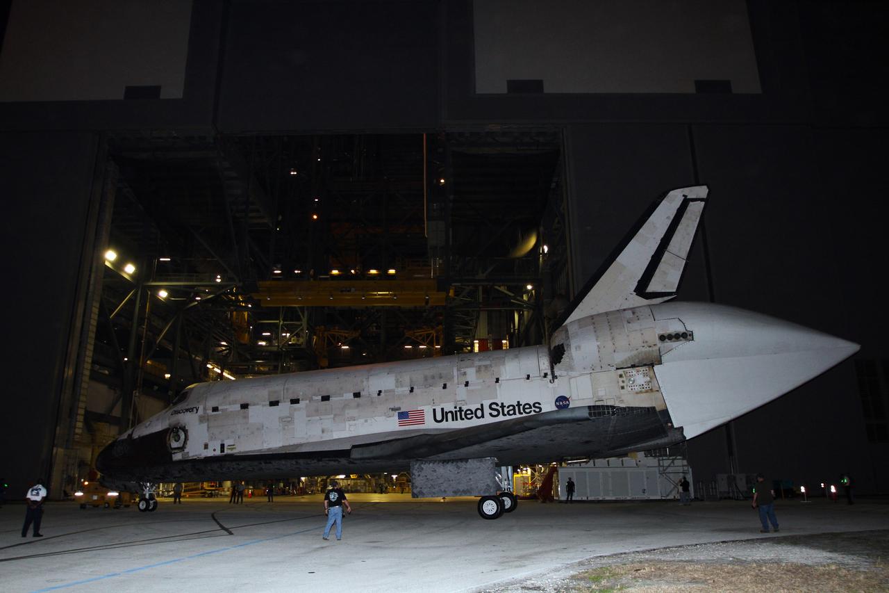 CAPE CANAVERAL, Fla. – Space shuttle Discovery completes a three-point turnaround outside the Vehicle Assembly Building, or VAB, at NASA’s Kennedy Space Center in Florida, for its trip to the Shuttle Landing Facility, or SLF. Its move got under way at 5 a.m. EDT. A tail cone has been installed over its three replica shuttle main engines to reduce aerodynamic drag and turbulence during its upcoming ferry flight.     Discovery was in storage in the VAB’s high bay 4 awaiting departure from Kennedy’s Launch Complex 39 area for the final time.  At the SLF, Discovery will be hoisted onto a Shuttle Carrier Aircraft, or SCA, with the aid of a mate-demate device.  The SCA, a modified Boeing 747 jet airliner, is scheduled to transport Discovery to the Washington Dulles International Airport in Virginia on April 17, after which the shuttle will be placed on permanent public display in the Smithsonian's National Air and Space Museum Steven F. Udvar-Hazy Center.  For more information on shuttle transition and retirement activities, visit http://www.nasa.gov/transition. Photo credit: NASA/Kim Shiflett