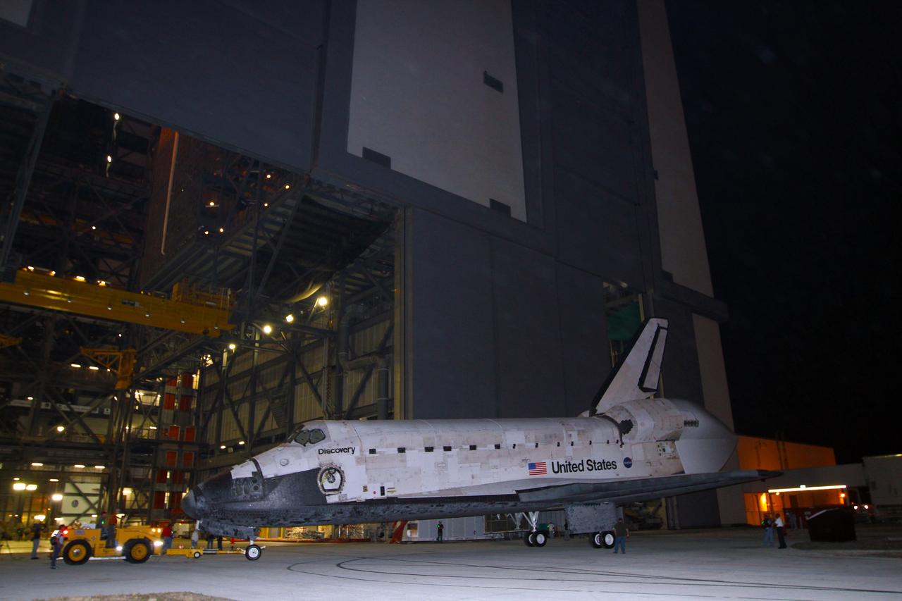 CAPE CANAVERAL, Fla. – Space shuttle Discovery completes a three-point turnaround outside the Vehicle Assembly Building, or VAB, at NASA’s Kennedy Space Center in Florida, for its trip to the Shuttle Landing Facility, or SLF. Its move got under way at 5 a.m. EDT. Discovery was in storage in the VAB’s high bay 4 awaiting departure from Kennedy’s Launch Complex 39 area for the final time. At the SLF, Discovery will be hoisted onto a Shuttle Carrier Aircraft, or SCA, with the aid of a mate-demate device. The SCA, a modified Boeing 747 jet airliner, is scheduled to transport Discovery to the Washington Dulles International Airport in Virginia on April 17, after which the shuttle will be placed on permanent public display in the Smithsonian's National Air and Space Museum Steven F. Udvar-Hazy Center. For more information on shuttle transition and retirement activities, visit http://www.nasa.gov/transition. Photo credit: NASA/Kim Shiflett