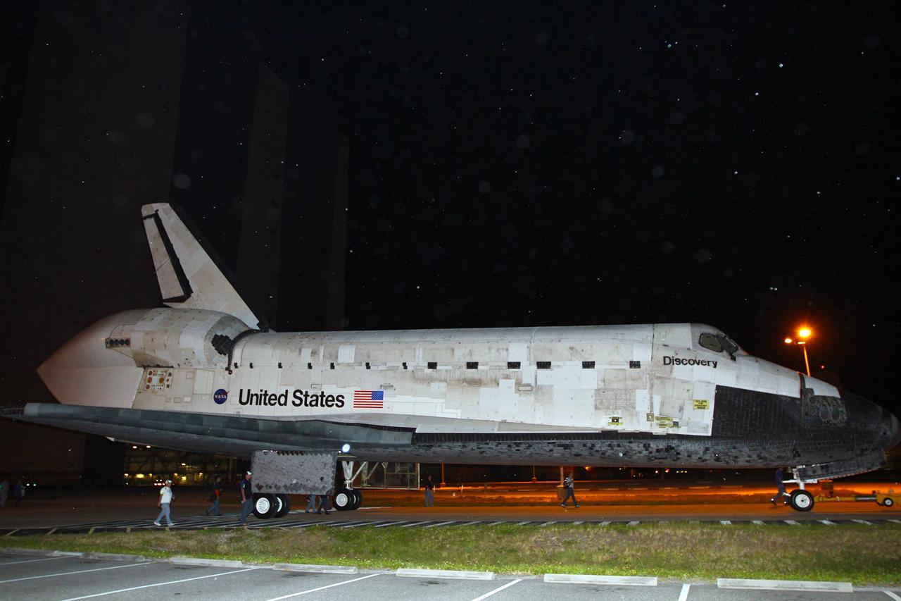 CAPE CANAVERAL, Fla. – Rain begins to fall on space shuttle Discovery as it says good-bye to NASA Kennedy Space Center’s Launch Complex 39 area for the final time.    Discovery is on its way from the Vehicle Assembly Building’s high bay 4 to the Shuttle Landing Facility, or SLF.  At the SLF, Discovery will be hoisted onto a Shuttle Carrier Aircraft, or SCA, with the aid of a mate-demate device.  The SCA, a modified Boeing 747 jet airliner, is scheduled to ferry Discovery to the Washington Dulles International Airport in Virginia on April 17, after which the shuttle will be placed on permanent public display in the Smithsonian's National Air and Space Museum Steven F. Udvar-Hazy Center.  For more information on shuttle transition and retirement activities, visit http://www.nasa.gov/transition. Photo credit: NASA/Kim Shiflett