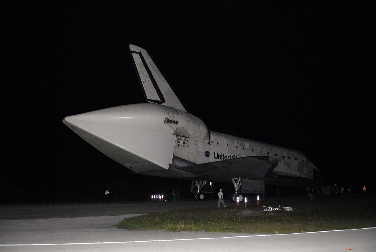 CAPE CANAVERAL, Fla. – Space shuttle Discovery makes its way in darkness along the access road to the Shuttle Landing Facility, or SLF, at NASA’s Kennedy Space Center in Florida. A tail cone has been installed over its three replica shuttle main engines to reduce aerodynamic drag and turbulence during its upcoming ferry flight.    At the SLF, Discovery will be hoisted onto a Shuttle Carrier Aircraft, or SCA, with the aid of a mate-demate device.  The SCA, a modified Boeing 747 jet airliner, is scheduled to ferry Discovery to the Washington Dulles International Airport in Virginia on April 17, after which the shuttle will be placed on permanent public display in the Smithsonian's National Air and Space Museum Steven F. Udvar-Hazy Center.  For more information on shuttle transition and retirement activities, visit http://www.nasa.gov/transition. Photo credit: NASA/Tim Jacobs