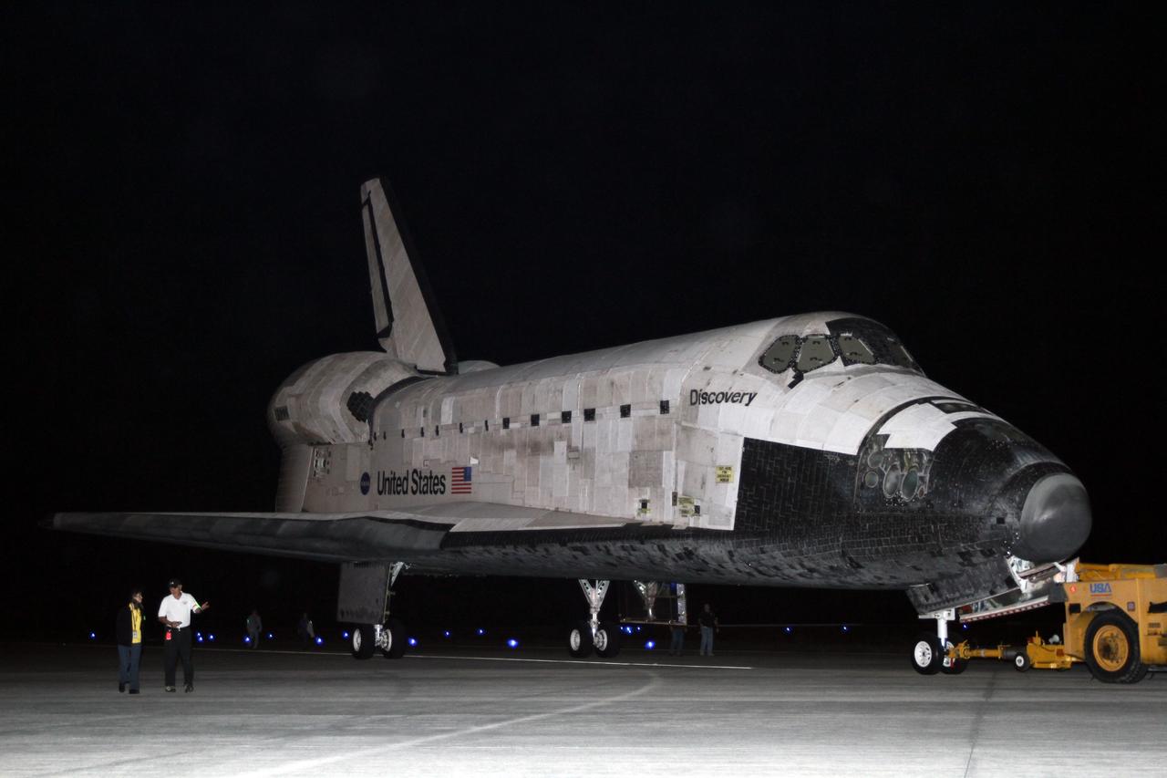 CAPE CANAVERAL, Fla. – Space shuttle Discovery makes its way in darkness to the Shuttle Landing Facility, or SLF, at NASA’s Kennedy Space Center in Florida.  Its move got under way at 5 a.m. EDT.    At the SLF, Discovery will be hoisted onto a Shuttle Carrier Aircraft, or SCA, with the aid of a mate-demate device.  The SCA, a modified Boeing 747 jet airliner, is scheduled to ferry Discovery to the Washington Dulles International Airport in Virginia on April 17, after which the shuttle will be placed on permanent public display in the Smithsonian's National Air and Space Museum Steven F. Udvar-Hazy Center.  For more information on shuttle transition and retirement activities, visit http://www.nasa.gov/transition. Photo credit: NASA/Kim Shiflett