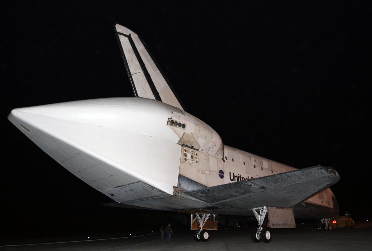 CAPE CANAVERAL, Fla. – Space shuttle Discovery makes its way in darkness to the Shuttle Landing Facility, or SLF, at NASA’s Kennedy Space Center in Florida. A tail cone has been installed over its three replica shuttle main engines to reduce aerodynamic drag and turbulence during its upcoming ferry flight.    At the SLF, Discovery will be hoisted onto a Shuttle Carrier Aircraft, or SCA, with the aid of a mate-demate device.  The SCA, a modified Boeing 747 jet airliner, is scheduled to ferry Discovery to the Washington Dulles International Airport in Virginia on April 17, after which the shuttle will be placed on permanent public display in the Smithsonian's National Air and Space Museum Steven F. Udvar-Hazy Center.  For more information on shuttle transition and retirement activities, visit http://www.nasa.gov/transition. Photo credit: NASA/Kim Shiflett