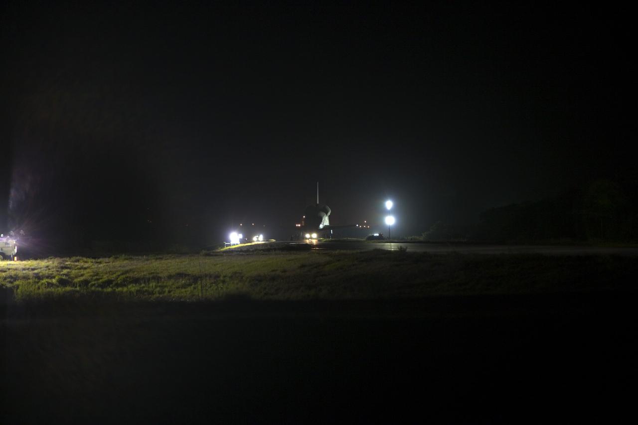 CAPE CANAVERAL, Fla. – Space shuttle Discovery makes its way to the Shuttle Landing Facility, or SLF, in darkness at NASA’s Kennedy Space Center in Florida. Its move from the Vehicle Assembly Building got under way at 5 a.m. EDT. At the SLF, Discovery will be hoisted onto a Shuttle Carrier Aircraft, or SCA, with the aid of a mate-demate device. The SCA, a modified Boeing 747 jet airliner, is scheduled to ferry Discovery to the Washington Dulles International Airport in Virginia on April 17, after which the shuttle will be placed on permanent public display in the Smithsonian's National Air and Space Museum Steven F. Udvar-Hazy Center. For more information on shuttle transition and retirement activities, visit http://www.nasa.gov/transition. Photo credit: NASA/Dimitri Gerondidakis