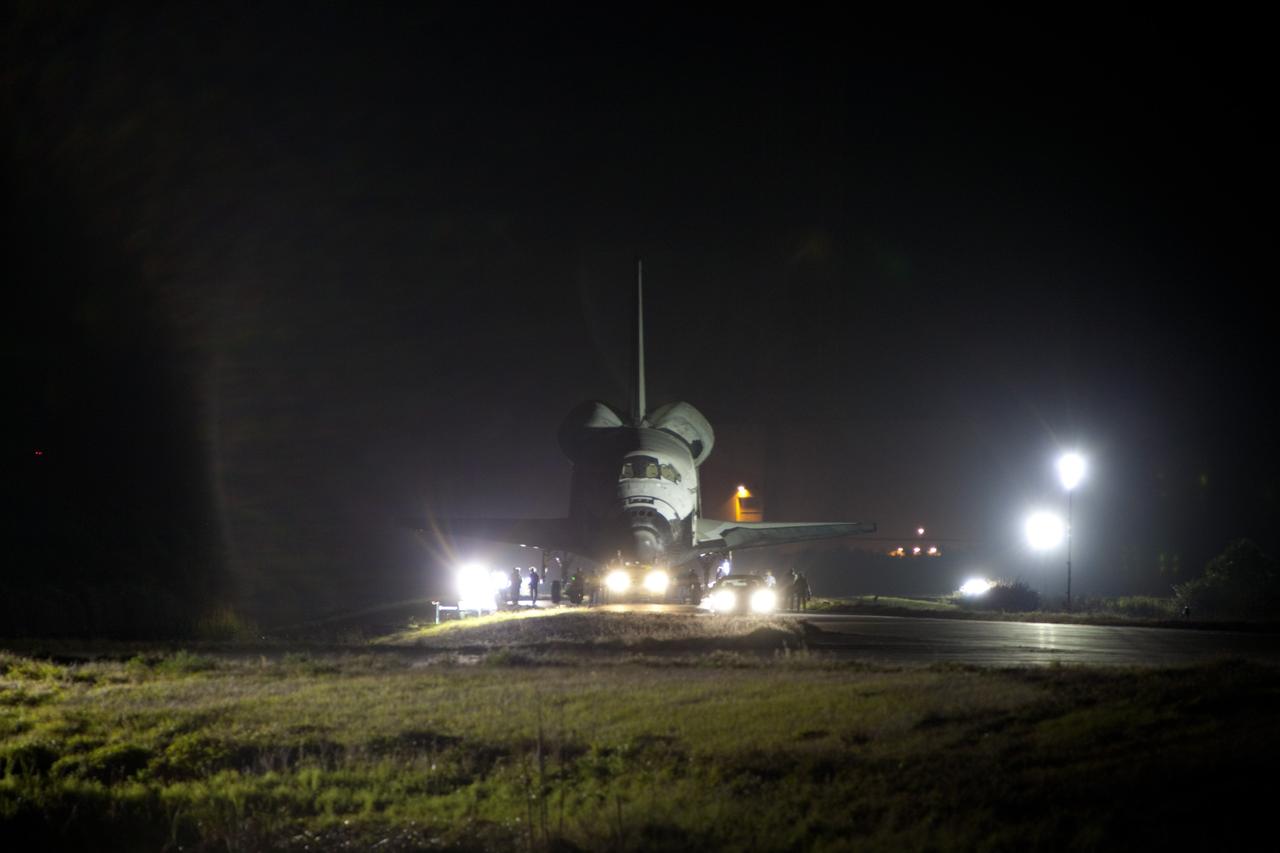 CAPE CANAVERAL, Fla. – Space shuttle Discovery makes its way to the Shuttle Landing Facility, or SLF, in darkness at NASA’s Kennedy Space Center in Florida.  Its move from the Vehicle Assembly Building got under way at 5 a.m. EDT.    At the SLF, Discovery will be hoisted onto a Shuttle Carrier Aircraft, or SCA, with the aid of a mate-demate device.  The SCA, a modified Boeing 747 jet airliner, is scheduled to ferry Discovery to the Washington Dulles International Airport in Virginia on April 17, after which the shuttle will be placed on permanent public display in the Smithsonian's National Air and Space Museum Steven F. Udvar-Hazy Center.  For more information on shuttle transition and retirement activities, visit http://www.nasa.gov/transition. Photo credit: NASA/Dimitri Gerondidakis