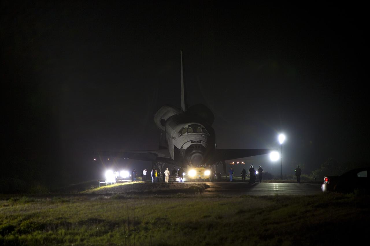 CAPE CANAVERAL, Fla. – Space shuttle Discovery makes its way to the Shuttle Landing Facility, or SLF, before dawn at NASA’s Kennedy Space Center in Florida.  Its move from the Vehicle Assembly Building got under way at 5 a.m. EDT.    At the SLF, Discovery will be hoisted onto a Shuttle Carrier Aircraft, or SCA, with the aid of a mate-demate device.  The SCA, a modified Boeing 747 jet airliner, is scheduled to ferry Discovery to the Washington Dulles International Airport in Virginia on April 17, after which the shuttle will be placed on permanent public display in the Smithsonian's National Air and Space Museum Steven F. Udvar-Hazy Center.  For more information on shuttle transition and retirement activities, visit http://www.nasa.gov/transition. Photo credit: NASA/Dimitri Gerondidakis