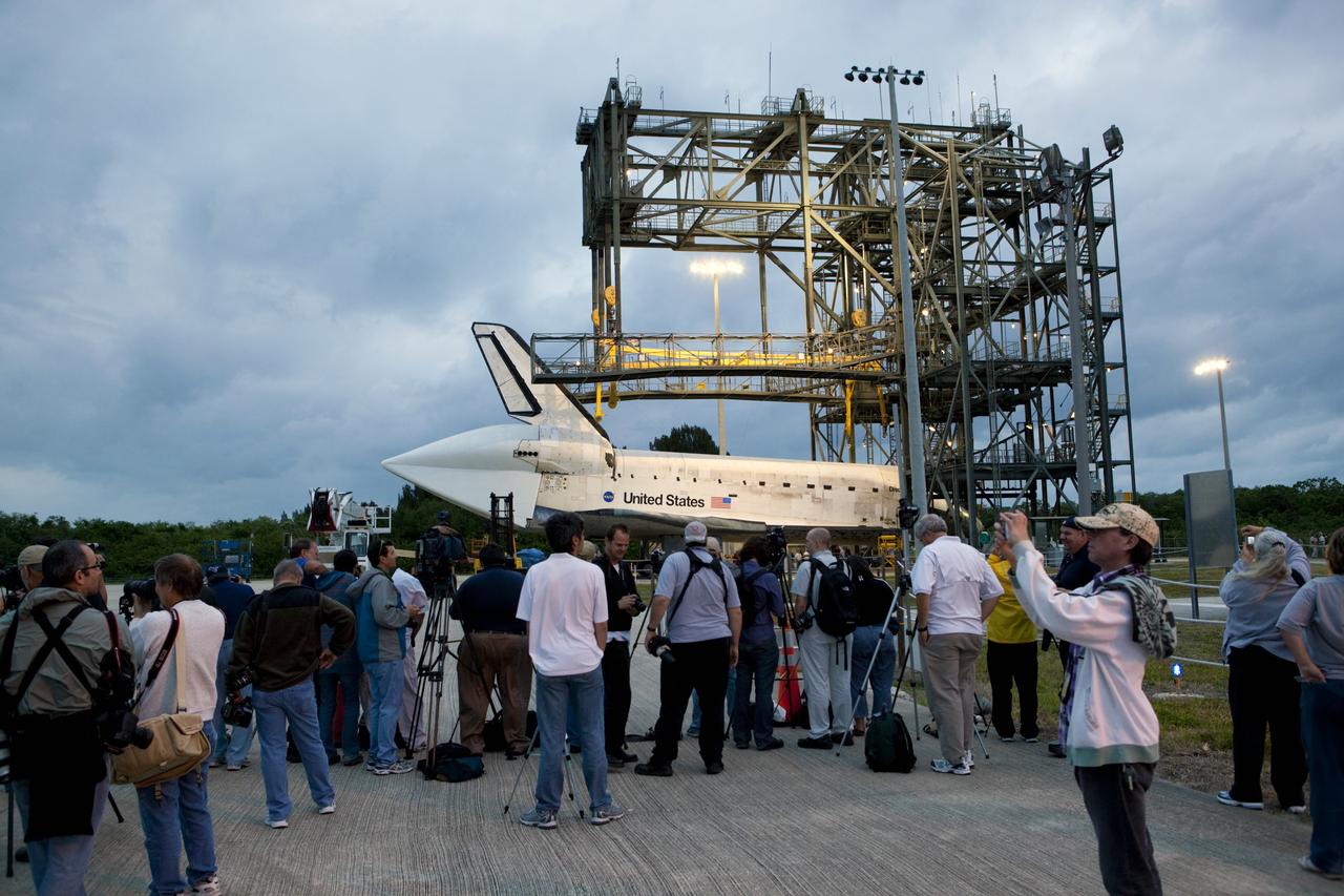 CAPE CANAVERAL, Fla. – Media representatives are on hand for the arrival of space shuttle Discovery at the mate-demate device, or MDD, at the Shuttle Landing Facility, or SLF, at NASA’s Kennedy Space Center in Florida. A tail cone has been installed over its three replica shuttle main engines to reduce aerodynamic drag and turbulence during its upcoming ferry flight. The MDD is a large gantry-like steel structure used to hoist a shuttle off the ground and position it onto the back of a Shuttle Carrier Aircraft, or SCA. The SCA is a Boeing 747 jet, originally manufactured for commercial use, which was modified by NASA to transport the shuttles between destinations on Earth. The SCA designated NASA 905 is assigned to the remaining ferry missions, delivering the shuttles to their permanent public display sites. Discovery’s new home will be the Smithsonian's National Air and Space Museum Steven F. Udvar-Hazy Center in Chantilly, Va. For more information on the SCA, visit http://www.nasa.gov/centers/dryden/news/FactSheets/FS-013-DFRC.html. For more information on shuttle transition and retirement activities, visit http://www.nasa.gov/transition. Photo credit: NASA/Dimitri Gerondidakis