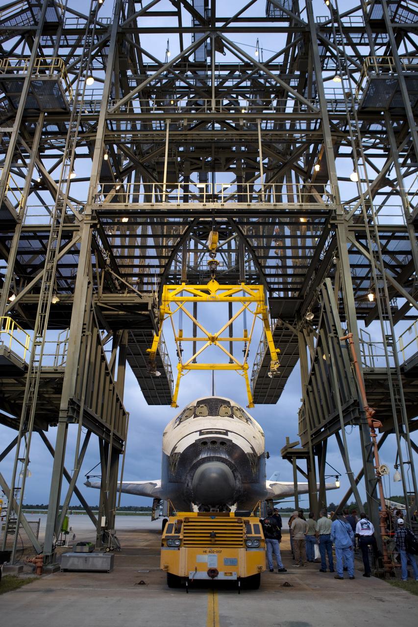CAPE CANAVERAL, Fla. – Preparations are under way at the the mate-demate device, or MDD, at the Shuttle Landing Facility at NASA’s Kennedy Space Center in Florida to lift space shuttle Discovery atop a Shuttle Carrier Aircraft, or SCA. The MDD is a large gantry-like steel structure used to hoist a shuttle off the ground and position it onto the back of an SCA. The SCA is a Boeing 747 jet, originally manufactured for commercial use, which was modified by NASA to transport the shuttles between destinations on Earth. The SCA designated NASA 905 is assigned to the remaining ferry missions, delivering the shuttles to their permanent public display sites. Discovery’s new home will be the Smithsonian's National Air and Space Museum Steven F. Udvar-Hazy Center in Chantilly, Va. For more information on the SCA, visit http://www.nasa.gov/centers/dryden/news/FactSheets/FS-013-DFRC.html. For more information on shuttle transition and retirement activities, visit http://www.nasa.gov/transition. Photo credit: NASA/Dimitri Gerondidakis