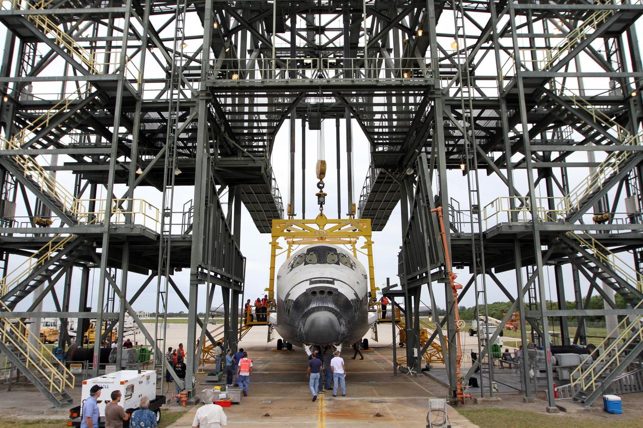 CAPE CANAVERAL, Fla. – At the Shuttle Landing Facility at NASA’s Kennedy Space Center in Florida, operations are under way at the mate-demate device to lift space shuttle Discovery on top of a Shuttle Carrier Aircraft. The device, known as the MDD, is a large gantry-like steel structure used to hoist a shuttle off the ground and position it onto the back of the aircraft, or SCA. The SCA is a Boeing 747 jet, originally manufactured for commercial use, which was modified by NASA to transport the shuttles between destinations on Earth. The SCA designated NASA 905 is assigned to the remaining ferry missions, delivering the shuttles to their permanent public display sites. NASA 905 is scheduled to ferry Discovery to the Washington Dulles International Airport in Virginia on April 17, after which the shuttle will be placed on display in the Smithsonian's National Air and Space Museum Steven F. Udvar-Hazy Center. For more information on the SCA, visit http://www.nasa.gov/centers/dryden/news/FactSheets/FS-013-DFRC.html. For more information on shuttle transition and retirement activities, visit http://www.nasa.gov/transition. Photo credit: NASA/Kim Shiflett
