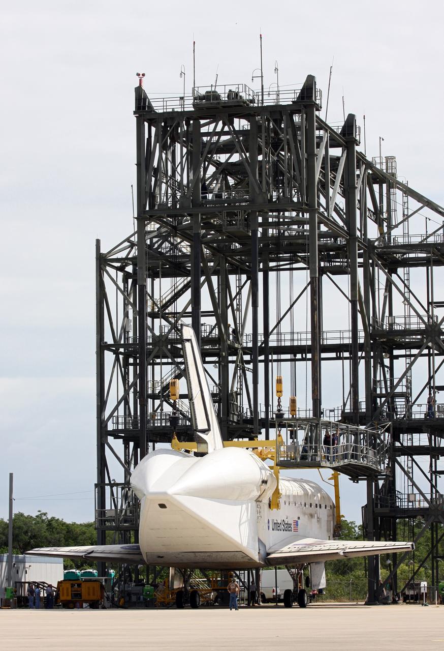 CAPE CANAVERAL, Fla. – At the Shuttle Landing Facility at NASA’s Kennedy Space Center in Florida, operations are under way at the mate-demate device to lift space shuttle Discovery on top of a Shuttle Carrier Aircraft. The device, known as the MDD, is a large gantry-like steel structure used to hoist a shuttle off the ground and position it onto the back of the aircraft, or SCA. The SCA is a Boeing 747 jet, originally manufactured for commercial use, which was modified by NASA to transport the shuttles between destinations on Earth. The SCA designated NASA 905 is assigned to the remaining ferry missions, delivering the shuttles to their permanent public display sites. NASA 905 is scheduled to ferry Discovery to the Washington Dulles International Airport in Virginia on April 17, after which the shuttle will be placed on display in the Smithsonian's National Air and Space Museum Steven F. Udvar-Hazy Center. For more information on the SCA, visit http://www.nasa.gov/centers/dryden/news/FactSheets/FS-013-DFRC.html. For more information on shuttle transition and retirement activities, visit http://www.nasa.gov/transition. Photo credit: NASA/Kim Shiflett