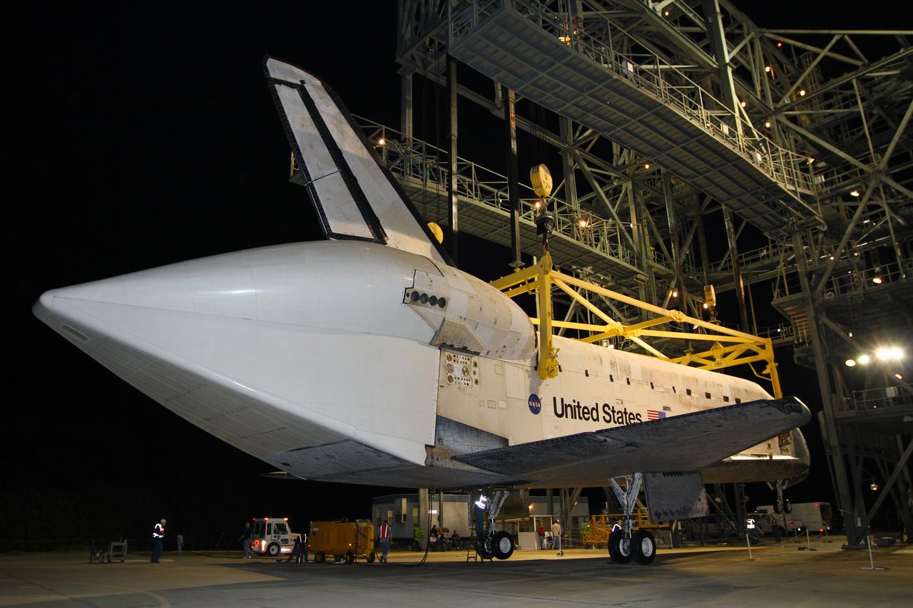 CAPE CANAVERAL, Fla. – Before daybreak at the Shuttle Landing Facility at NASA’s Kennedy Space Center in Florida, a crane on the mate-demate device lifts space shuttle Discovery from the ground. Operations are under way to position Discovery on top of a Shuttle Carrier Aircraft in preparation for its departure from Kennedy on Tuesday. A tail cone has been installed over Discovery’s three replica shuttle main engines to reduce aerodynamic drag and turbulence during the ferry flight. The device, known as the MDD, is a large gantry-like steel structure used to hoist a shuttle off the ground and position it onto the back of the aircraft, or SCA. The SCA is a Boeing 747 jet, originally manufactured for commercial use, which was modified by NASA to transport the shuttles between destinations on Earth. The SCA designated NASA 905 is assigned to the remaining ferry missions, delivering the shuttles to their permanent public display sites. NASA 905 is scheduled to ferry Discovery to the Washington Dulles International Airport in Virginia on April 17, after which the shuttle will be placed on display in the Smithsonian's National Air and Space Museum Steven F. Udvar-Hazy Center. For more information on the SCA, visit http://www.nasa.gov/centers/dryden/news/FactSheets/FS-013-DFRC.html. For more information on shuttle transition and retirement activities, visit http://www.nasa.gov/transition. Photo credit: NASA/Kim Shiflett