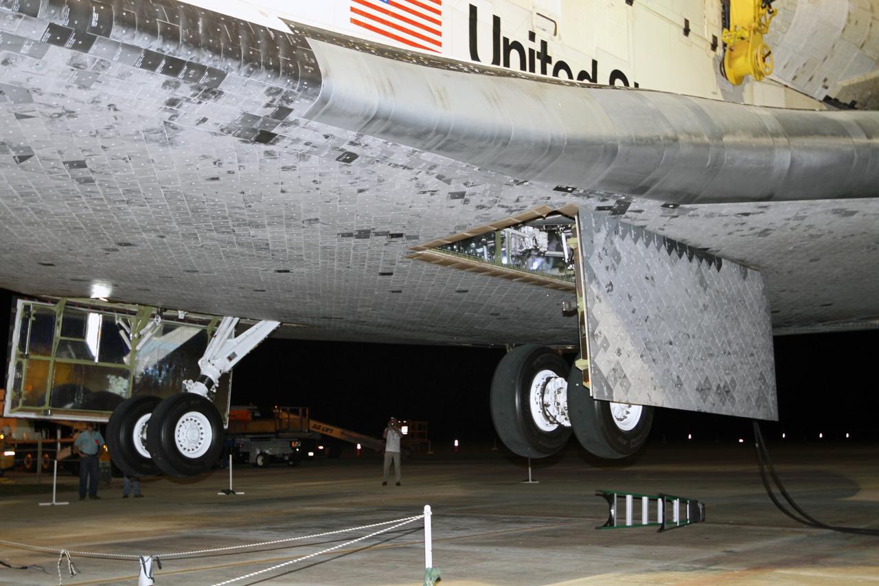 CAPE CANAVERAL, Fla. – At the Shuttle Landing Facility at NASA’s Kennedy Space Center in Florida, space shuttle Discovery is lifted off the ground into the mate-demate device. Operations are under way to position Discovery on top of a Shuttle Carrier Aircraft in preparation for its departure from Kennedy on Tuesday.    The device, known as the MDD, is a large gantry-like steel structure used to hoist a shuttle off the ground and position it onto the back of the aircraft, or SCA. The SCA is a Boeing 747 jet, originally manufactured for commercial use, which was modified by NASA to transport the shuttles between destinations on Earth. The SCA designated NASA 905 is assigned to the remaining ferry missions, delivering the shuttles to their permanent public display sites.  NASA 905 is scheduled to ferry Discovery to the Washington Dulles International Airport in Virginia on April 17, after which the shuttle will be placed on display in the Smithsonian's National Air and Space Museum Steven F. Udvar-Hazy Center. For more information on the SCA, visit http://www.nasa.gov/centers/dryden/news/FactSheets/FS-013-DFRC.html. For more information on shuttle transition and retirement activities, visit http://www.nasa.gov/transition. Photo credit: NASA/Kim Shiflett