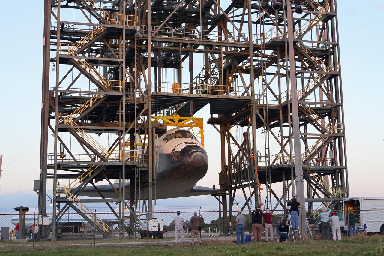 CAPE CANAVERAL, Fla. – At the Shuttle Landing Facility at NASA’s Kennedy Space Center in Florida, space shuttle Discovery is raised into the mate-demate device during operations to place it on top of a Shuttle Carrier Aircraft.     The device, known as the MDD, is a large gantry-like steel structure used to hoist a shuttle off the ground and position it onto the back of the aircraft, or SCA. The SCA is a Boeing 747 jet, originally manufactured for commercial use, which was modified by NASA to transport the shuttles between destinations on Earth. The SCA designated NASA 905 is assigned to the remaining ferry missions, delivering the shuttles to their permanent public display sites.  NASA 905 is scheduled to ferry Discovery to the Washington Dulles International Airport in Virginia on April 17, after which the shuttle will be placed on display in the Smithsonian's National Air and Space Museum Steven F. Udvar-Hazy Center. For more information on the SCA, visit http://www.nasa.gov/centers/dryden/news/FactSheets/FS-013-DFRC.html. For more information on shuttle transition and retirement activities, visit http://www.nasa.gov/transition. Photo credit: NASA/Kim Shiflett
