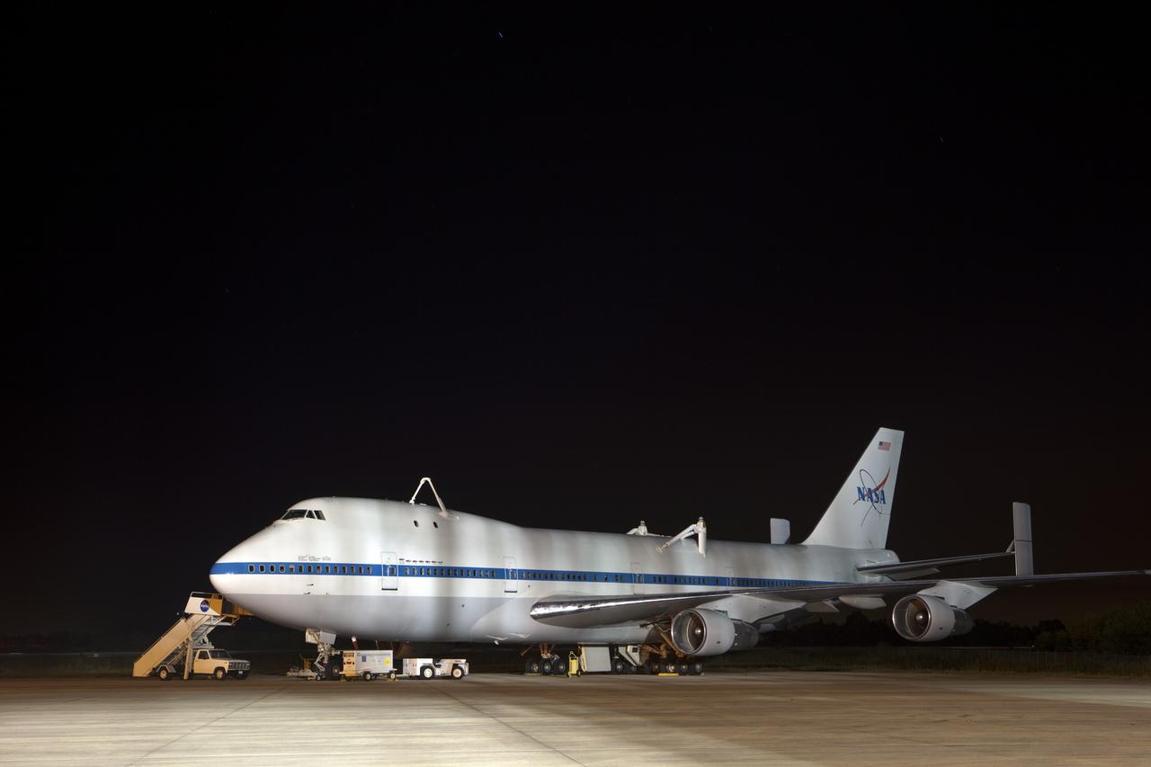 CAPE CANAVERAL, Fla. – A Shuttle Carrier Aircraft, or SCA, is readied for mating with the space shuttle Discovery at the Shuttle Landing Facility at NASA’s Kennedy Space Center in Florida. This SCA, designated NASA 905, is a Boeing 747 jet originally manufactured for commercial use, which was modified by NASA to transport the shuttles between destinations on Earth. NASA 905 is assigned to the remaining ferry missions, delivering the shuttles to their permanent public display sites. Discovery’s new home will be the Smithsonian's National Air and Space Museum Steven F. Udvar-Hazy Center in Chantilly, Va. For more information on the SCA, visit http://www.nasa.gov/centers/dryden/news/FactSheets/FS-013-DFRC.html. For more information on shuttle transition and retirement activities, visit http://www.nasa.gov/transition. Photo credit: NASA/Dimitri Gerondidakis     The device, known as the MDD, is a large gantry-like steel structure used to hoist a shuttle off the ground and position it onto the back of the aircraft, or SCA. The SCA is a Boeing 747 jet, originally manufactured for commercial use, which was modified by NASA to transport the shuttles between destinations on Earth. The SCA designated NASA 905 is assigned to the remaining ferry missions, delivering the shuttles to their permanent public display sites.  NASA 905 is scheduled to ferry Discovery to the Washington Dulles International Airport in Virginia on April 17, after which the shuttle will be placed on display in the Smithsonian's National Air and Space Museum Steven F. Udvar-Hazy Center. For more information on the SCA, visit http://www.nasa.gov/centers/dryden/news/FactSheets/FS-013-DFRC.html. For more information on shuttle transition and retirement activities, visit http://www.nasa.gov/transition. Photo credit: NASA