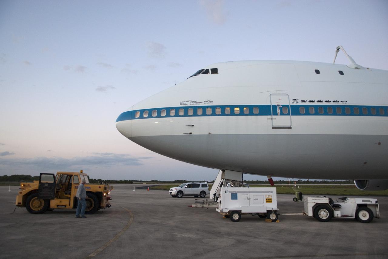 CAPE CANAVERAL, Fla. – At the Shuttle Landing Facility at NASA’s Kennedy Space Center in Florida, painted graphics line the side of NASA 905 depicting the various ferry flights the Shuttle Carrier Aircraft has supported during the Space Shuttle Program, including the tests using the space shuttle prototype Enterprise, and the names of the pilots and flight engineers who have flown it. This SCA, designated NASA 905, is a Boeing 747 jet originally manufactured for commercial use, which was modified by NASA to transport the shuttles between destinations on Earth. NASA 905 is assigned to the remaining ferry missions, delivering the shuttles to their permanent public display sites. Discovery’s new home will be the Smithsonian's National Air and Space Museum Steven F. Udvar-Hazy Center in Chantilly, Va. For more information on the SCA, visit http://www.nasa.gov/centers/dryden/news/FactSheets/FS-013-DFRC.html. For more information on shuttle transition and retirement activities, visit http://www.nasa.gov/transition. Photo credit: NASA/Tim Jacobs