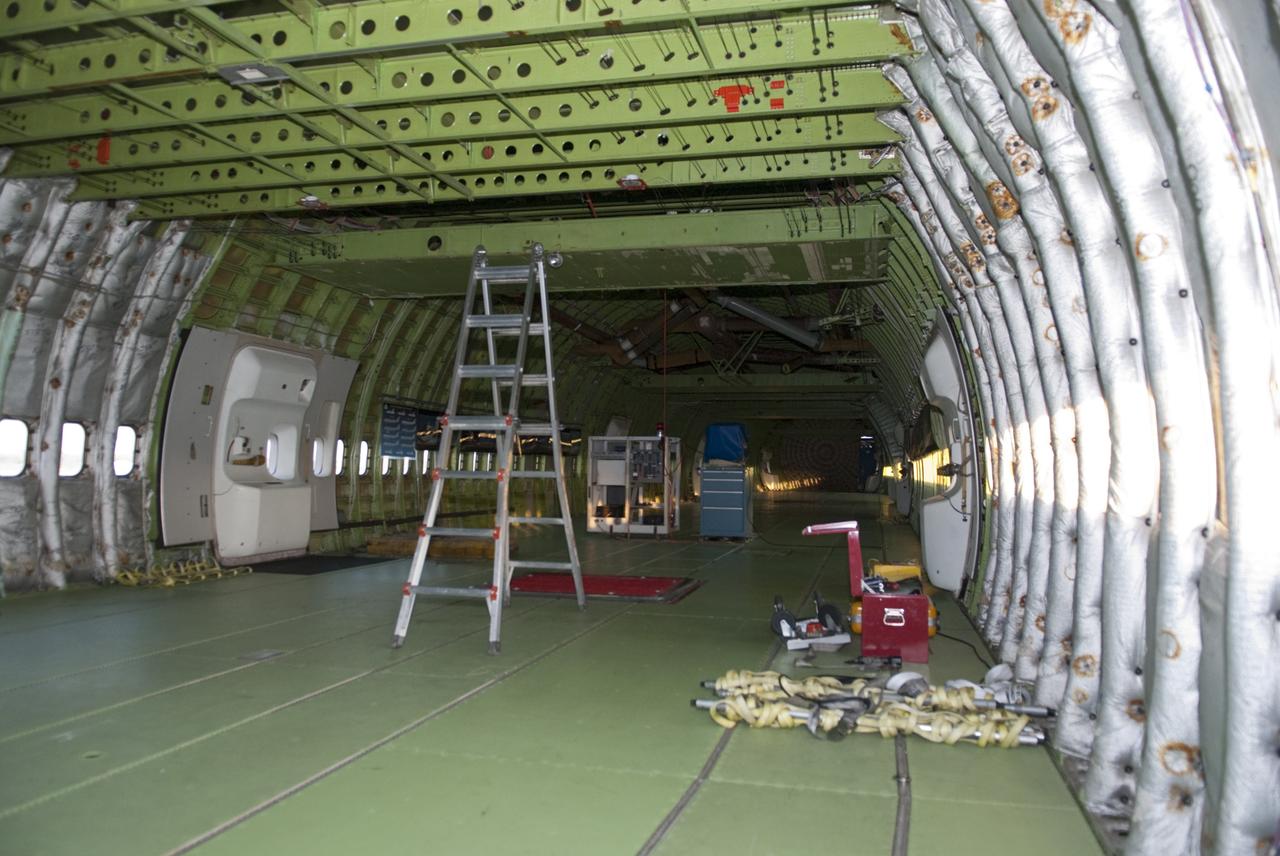 CAPE CANAVERAL, Fla. – At the Shuttle Landing Facility at NASA’s Kennedy Space Center in Florida, final preparations are made to the interior of the Shuttle Carrier Aircraft before it is towed to the mate-demate device for mating with space shuttle Discovery. This SCA, designated NASA 905, is a Boeing 747 jet originally manufactured for commercial use, which was modified by NASA to transport the shuttles between destinations on Earth. NASA 905 is assigned to the remaining ferry missions, delivering the shuttles to their permanent public display sites. Discovery’s new home will be the Smithsonian's National Air and Space Museum Steven F. Udvar-Hazy Center in Chantilly, Va. For more information on the SCA, visit http://www.nasa.gov/centers/dryden/news/FactSheets/FS-013-DFRC.html. For more information on shuttle transition and retirement activities, visit http://www.nasa.gov/transition. Photo credit: NASA/Tim Jacobs