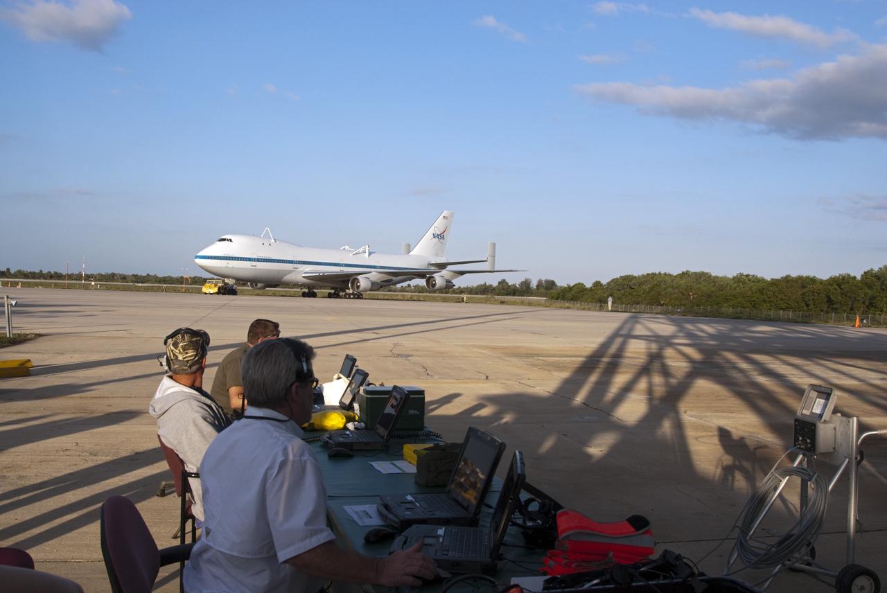 CAPE CANAVERAL, Fla. – At the Shuttle Landing Facility at NASA’s Kennedy Space Center in Florida, operations are under way to tow the Shuttle Carrier Aircraft to the mate-demate device for mating with space shuttle Discovery. This SCA, designated NASA 905, is a Boeing 747 jet originally manufactured for commercial use, which was modified by NASA to transport the shuttles between destinations on Earth. NASA 905 is assigned to the remaining ferry missions, delivering the shuttles to their permanent public display sites. Discovery’s new home will be the Smithsonian's National Air and Space Museum Steven F. Udvar-Hazy Center in Chantilly, Va. For more information on the SCA, visit http://www.nasa.gov/centers/dryden/news/FactSheets/FS-013-DFRC.html. For more information on shuttle transition and retirement activities, visit http://www.nasa.gov/transition. Photo credit: NASA/Tim Jacobs