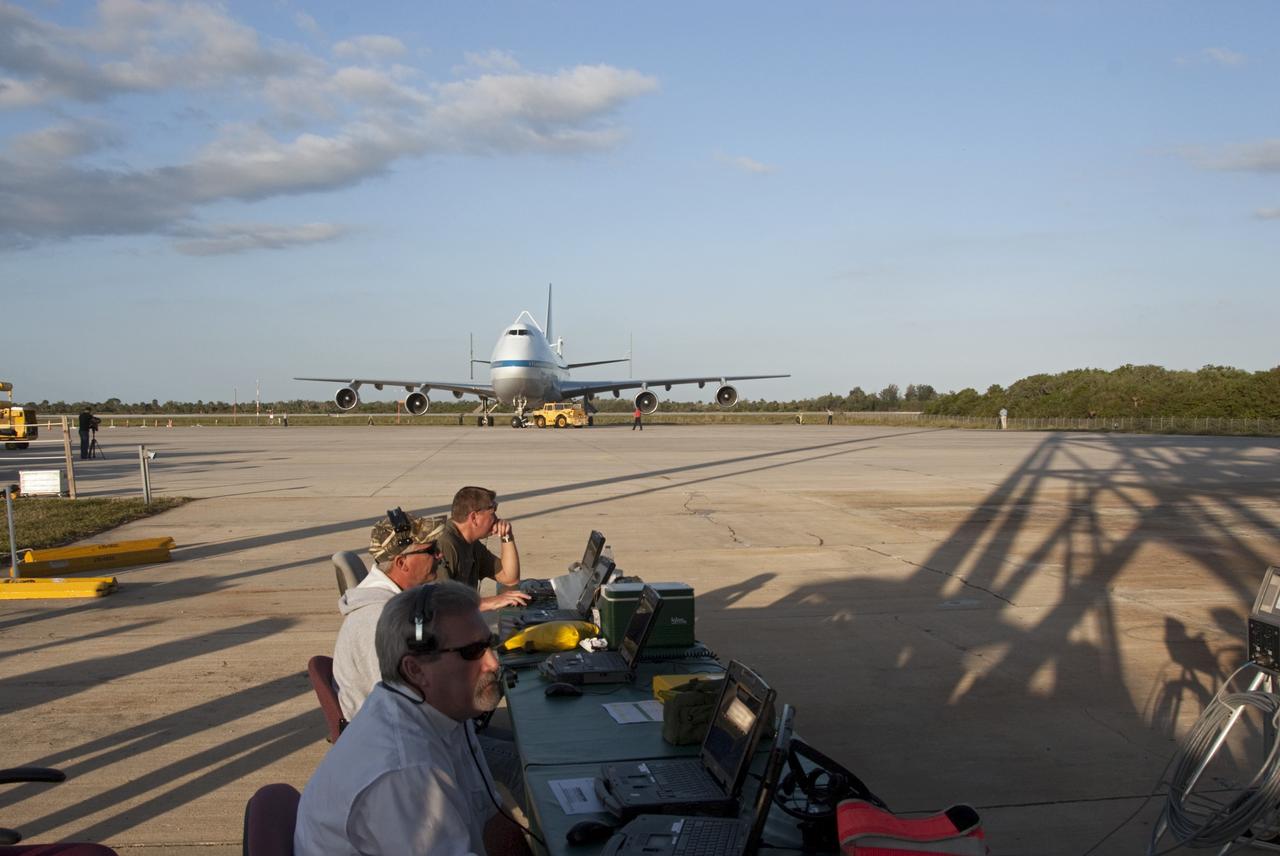 CAPE CANAVERAL, Fla. – At the Shuttle Landing Facility at NASA’s Kennedy Space Center in Florida, operations are under way to tow the Shuttle Carrier Aircraft to the mate-demate device for mating with space shuttle Discovery. This SCA, designated NASA 905, is a Boeing 747 jet originally manufactured for commercial use, which was modified by NASA to transport the shuttles between destinations on Earth. NASA 905 is assigned to the remaining ferry missions, delivering the shuttles to their permanent public display sites. Discovery’s new home will be the Smithsonian's National Air and Space Museum Steven F. Udvar-Hazy Center in Chantilly, Va. For more information on the SCA, visit http://www.nasa.gov/centers/dryden/news/FactSheets/FS-013-DFRC.html. For more information on shuttle transition and retirement activities, visit http://www.nasa.gov/transition. Photo credit: NASA/Tim Jacobs