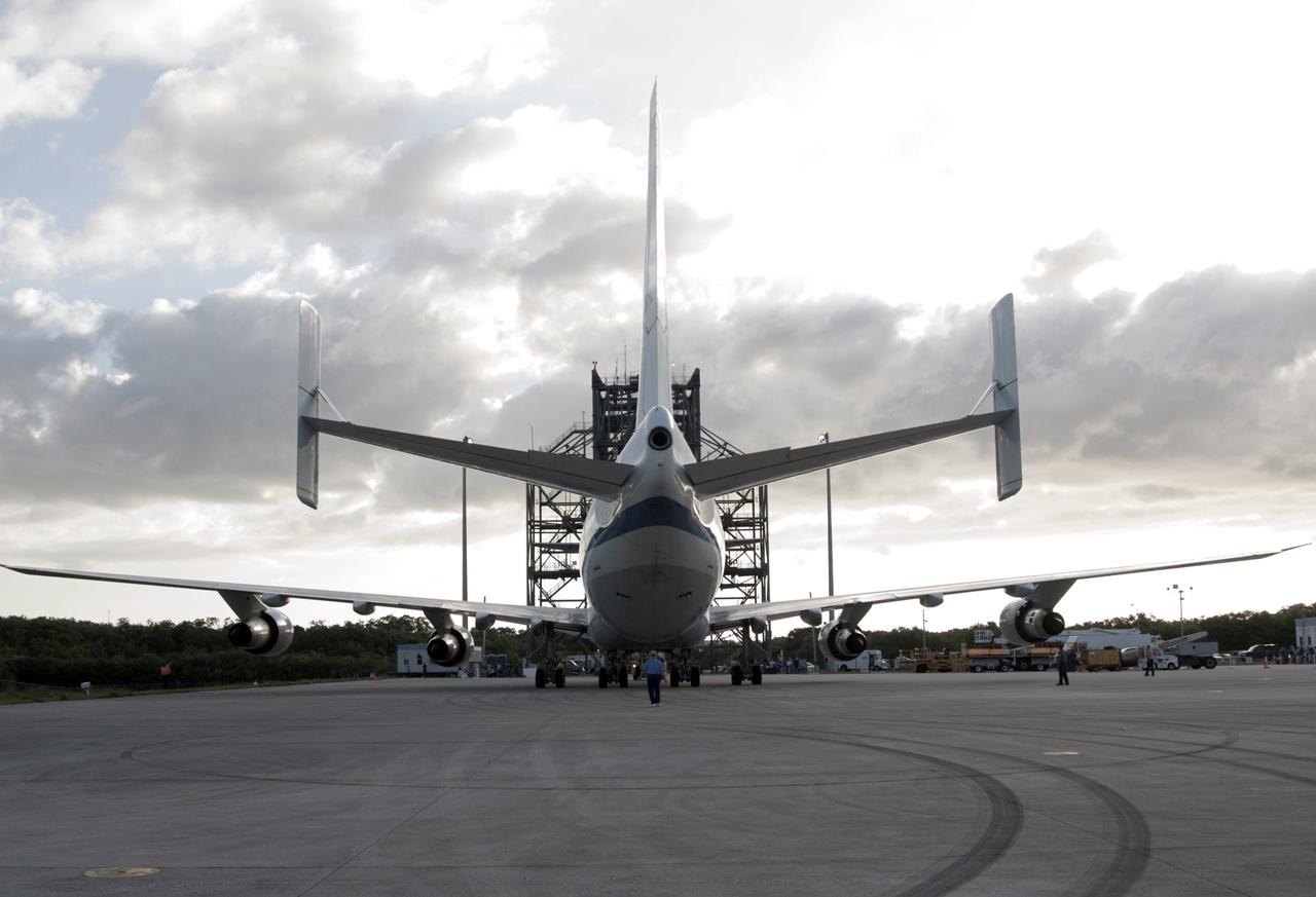 CAPE CANAVERAL, Fla. – At the Shuttle Landing Facility at NASA’s Kennedy Space Center in Florida, the Shuttle Carrier Aircraft approaches the mate-demate device, in the background, for mating with space shuttle Discovery. This SCA, designated NASA 905, is a Boeing 747 jet originally manufactured for commercial use, which was modified by NASA to transport the shuttles between destinations on Earth. NASA 905 is assigned to the remaining ferry missions, delivering the shuttles to their permanent public display sites. Discovery’s new home will be the Smithsonian's National Air and Space Museum Steven F. Udvar-Hazy Center in Chantilly, Va. For more information on the SCA, visit http://www.nasa.gov/centers/dryden/news/FactSheets/FS-013-DFRC.html. For more information on shuttle transition and retirement activities, visit http://www.nasa.gov/transition. Photo credit: NASA/Tim Jacobs