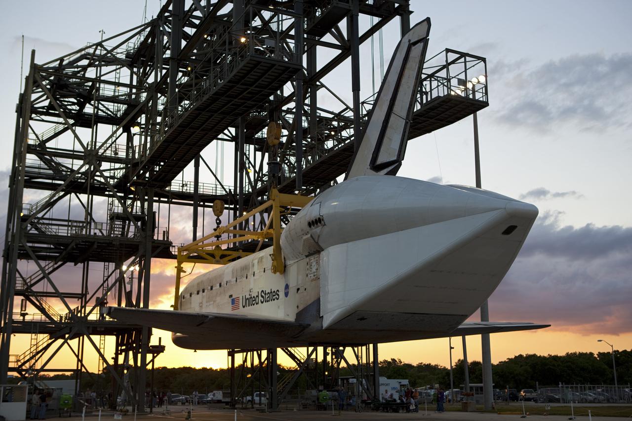 CAPE CANAVERAL, Fla. – At the Shuttle Landing Facility at NASA’s Kennedy Space Center in Florida, space shuttle Discovery slowly is lifted off the ground inside the mate-demate device in preparation for the arrival of the Shuttle Carrier Aircraft.  The device, known as the MDD, is a large gantry-like steel structure used to hoist a shuttle off the ground and position it onto the back of the aircraft, or SCA. The SCA is a Boeing 747 jet, originally manufactured for commercial use, which was modified by NASA to transport the shuttles between destinations on Earth. The SCA designated NASA 905 is assigned to the remaining ferry missions, delivering the shuttles to their permanent public display sites.  NASA 905 is scheduled to ferry Discovery to the Washington Dulles International Airport in Virginia on April 17, after which the shuttle will be placed on display in the Smithsonian's National Air and Space Museum Steven F. Udvar-Hazy Center. For more information on the SCA, visit http://www.nasa.gov/centers/dryden/news/FactSheets/FS-013-DFRC.html. For more information on shuttle transition and retirement activities, visit http://www.nasa.gov/transition.  Photo credit: NASA/Dimitri Gerondidakis