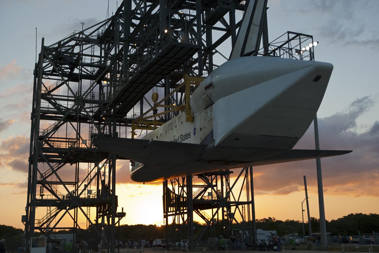 CAPE CANAVERAL, Fla. – At the Shuttle Landing Facility at NASA’s Kennedy Space Center in Florida, space shuttle Discovery slowly is lifted off the ground inside the mate-demate device in preparation for the arrival of the Shuttle Carrier Aircraft.  The device, known as the MDD, is a large gantry-like steel structure used to hoist a shuttle off the ground and position it onto the back of the aircraft, or SCA. The SCA is a Boeing 747 jet, originally manufactured for commercial use, which was modified by NASA to transport the shuttles between destinations on Earth. The SCA designated NASA 905 is assigned to the remaining ferry missions, delivering the shuttles to their permanent public display sites.  NASA 905 is scheduled to ferry Discovery to the Washington Dulles International Airport in Virginia on April 17, after which the shuttle will be placed on display in the Smithsonian's National Air and Space Museum Steven F. Udvar-Hazy Center. For more information on the SCA, visit http://www.nasa.gov/centers/dryden/news/FactSheets/FS-013-DFRC.html. For more information on shuttle transition and retirement activities, visit http://www.nasa.gov/transition.  Photo credit: NASA/Dimitri Gerondidakis