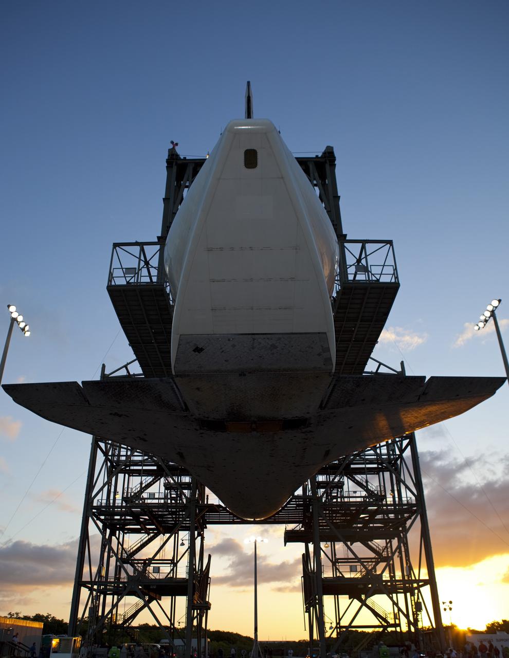 CAPE CANAVERAL, Fla. – At the Shuttle Landing Facility at NASA’s Kennedy Space Center in Florida, space shuttle Discovery slowly is lifted off the ground inside the mate-demate device in preparation for the arrival of the Shuttle Carrier Aircraft.  The device, known as the MDD, is a large gantry-like steel structure used to hoist a shuttle off the ground and position it onto the back of the aircraft, or SCA. The SCA is a Boeing 747 jet, originally manufactured for commercial use, which was modified by NASA to transport the shuttles between destinations on Earth. The SCA designated NASA 905 is assigned to the remaining ferry missions, delivering the shuttles to their permanent public display sites.  NASA 905 is scheduled to ferry Discovery to the Washington Dulles International Airport in Virginia on April 17, after which the shuttle will be placed on display in the Smithsonian's National Air and Space Museum Steven F. Udvar-Hazy Center. For more information on the SCA, visit http://www.nasa.gov/centers/dryden/news/FactSheets/FS-013-DFRC.html. For more information on shuttle transition and retirement activities, visit http://www.nasa.gov/transition.  Photo credit: NASA/Dimitri Gerondidakis