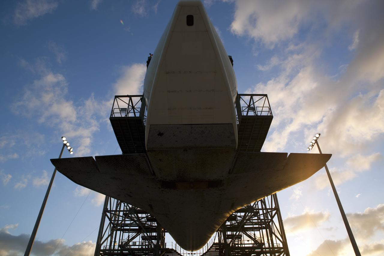 CAPE CANAVERAL, Fla. – At the Shuttle Landing Facility at NASA’s Kennedy Space Center in Florida, space shuttle Discovery is suspended 60 feet off the ground inside the mate-demate device in preparation for the arrival of the Shuttle Carrier Aircraft.  The device, known as the MDD, is a large gantry-like steel structure used to hoist a shuttle off the ground and position it onto the back of the aircraft, or SCA. The SCA is a Boeing 747 jet, originally manufactured for commercial use, which was modified by NASA to transport the shuttles between destinations on Earth. The SCA designated NASA 905 is assigned to the remaining ferry missions, delivering the shuttles to their permanent public display sites.  NASA 905 is scheduled to ferry Discovery to the Washington Dulles International Airport in Virginia on April 17, after which the shuttle will be placed on display in the Smithsonian's National Air and Space Museum Steven F. Udvar-Hazy Center. For more information on the SCA, visit http://www.nasa.gov/centers/dryden/news/FactSheets/FS-013-DFRC.html. For more information on shuttle transition and retirement activities, visit http://www.nasa.gov/transition.  Photo credit: NASA/Dimitri Gerondidakis