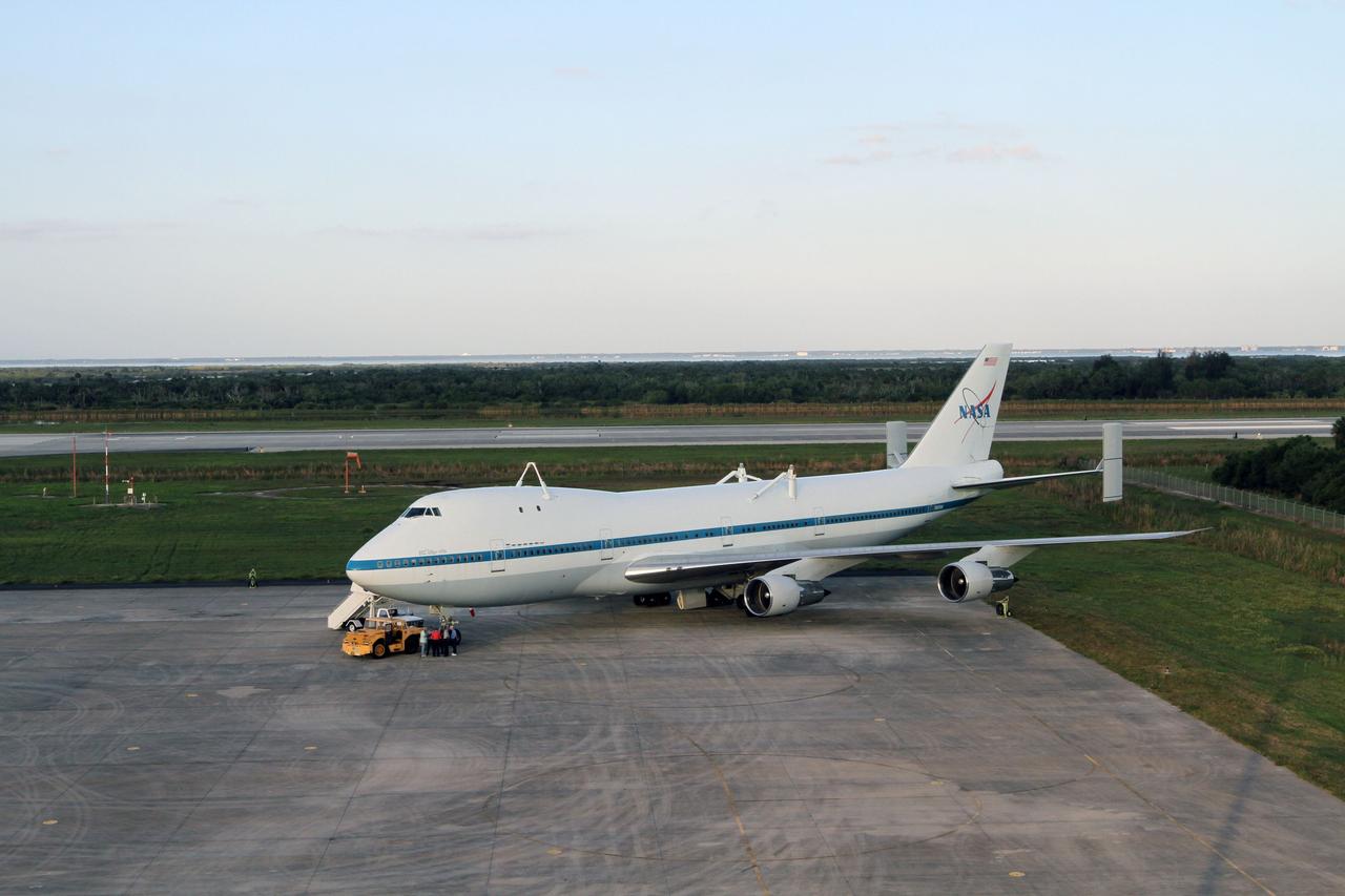 CAPE CANAVERAL, Fla. – At the Shuttle Landing Facility at NASA’s Kennedy Space Center in Florida, workers prepare to tow a Shuttle Carrier Aircraft to the mate-demate device for mating with space shuttle Discovery. This SCA, designated NASA 905, is a Boeing 747 jet originally manufactured for commercial use, which was modified by NASA to transport the shuttles between destinations on Earth. NASA 905 is assigned to the remaining ferry missions, delivering the shuttles to their permanent public display sites. Discovery’s new home will be the Smithsonian's National Air and Space Museum Steven F. Udvar-Hazy Center in Chantilly, Va. For more information on the SCA, visit http://www.nasa.gov/centers/dryden/news/FactSheets/FS-013-DFRC.html. For more information on shuttle transition and retirement activities, visit http://www.nasa.gov/transition. Photo credit: NASA/Kim Shiflett